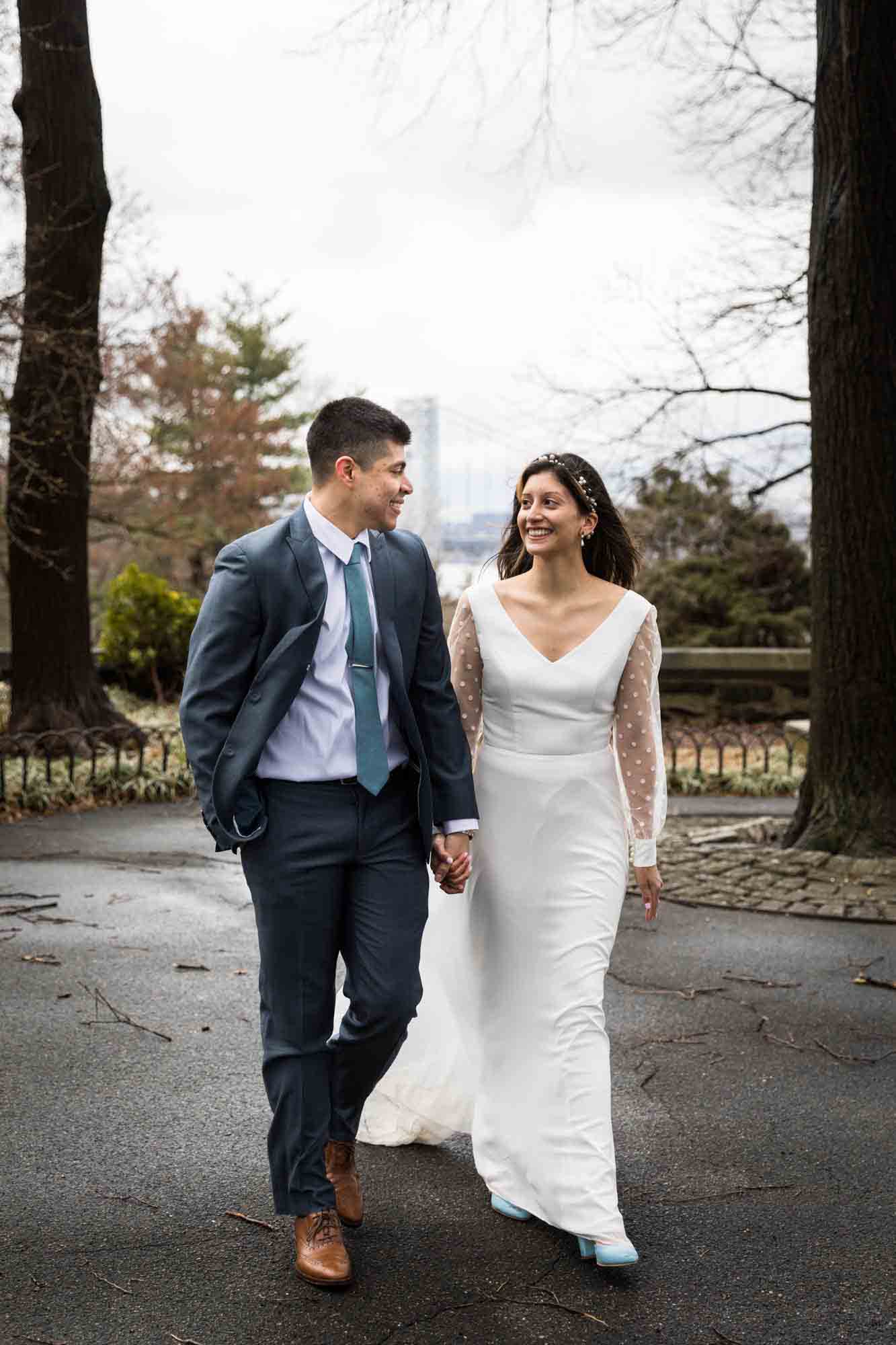 Bride and groom walking in Linden Terrace before a Fort Tryon Park wedding