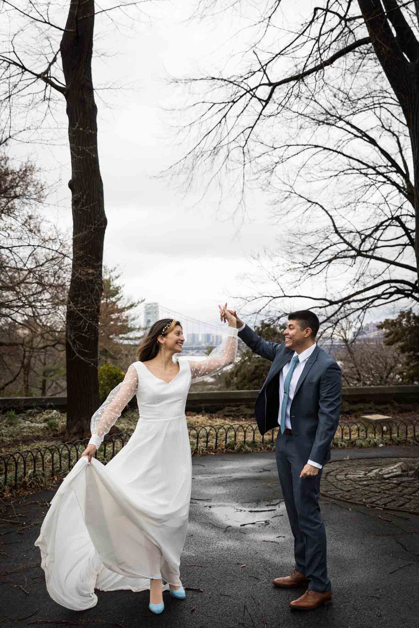 A bride and groom dancing on Linden Terrace during a Fort Tryon Park wedding