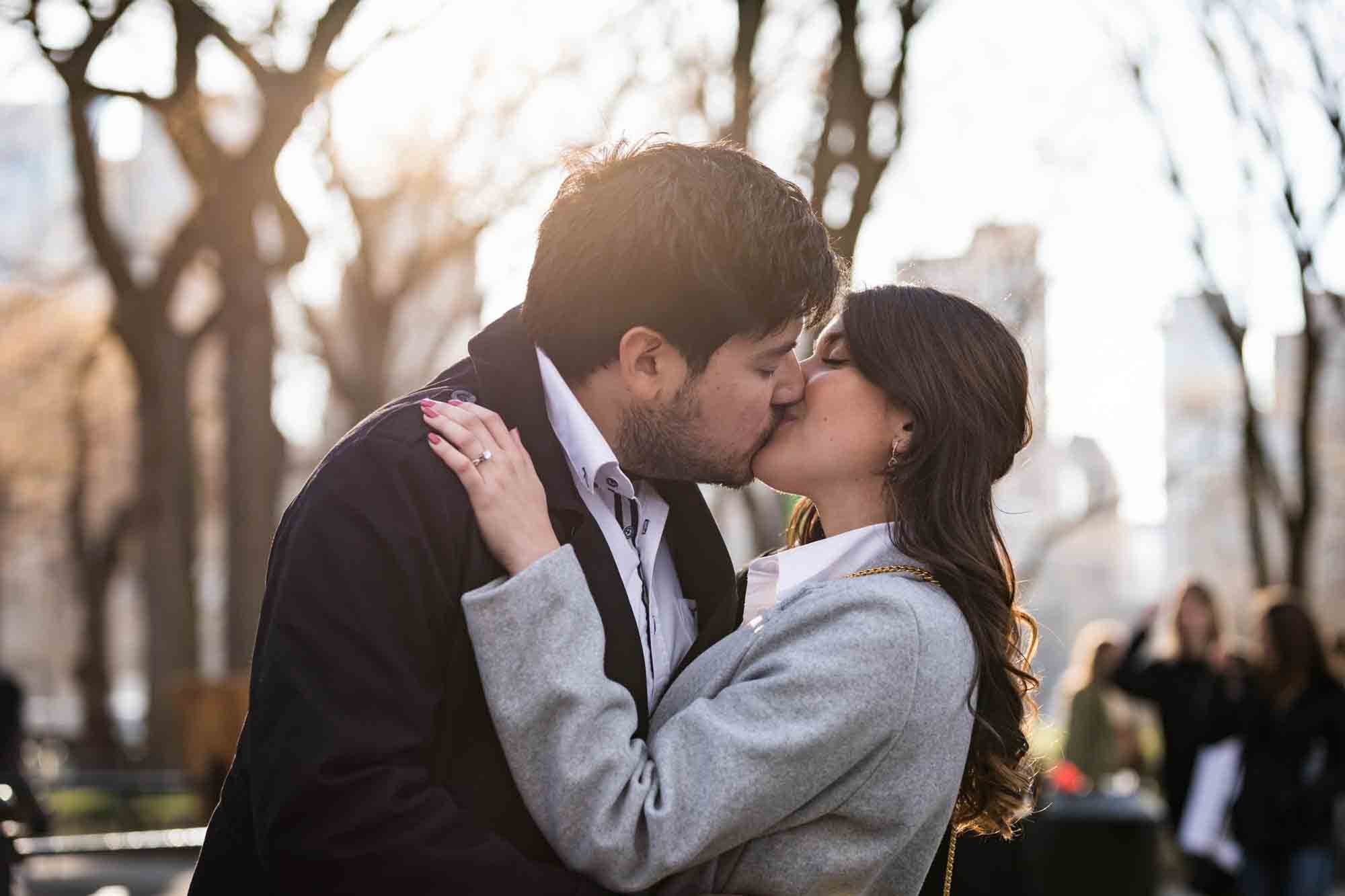 Couple kissing in Central Park after a NYC surprise proposal