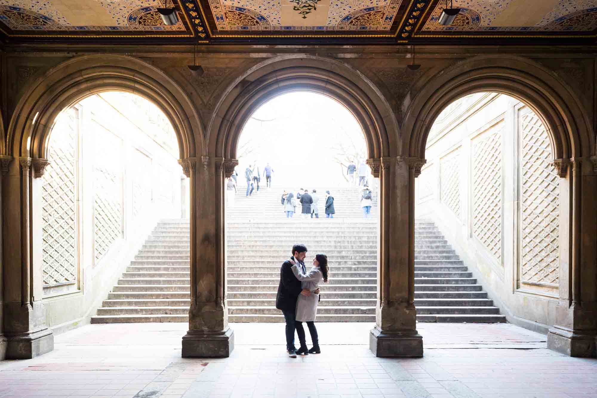 Couple dancing under Bethesda Terrace after a NYC surprise proposal