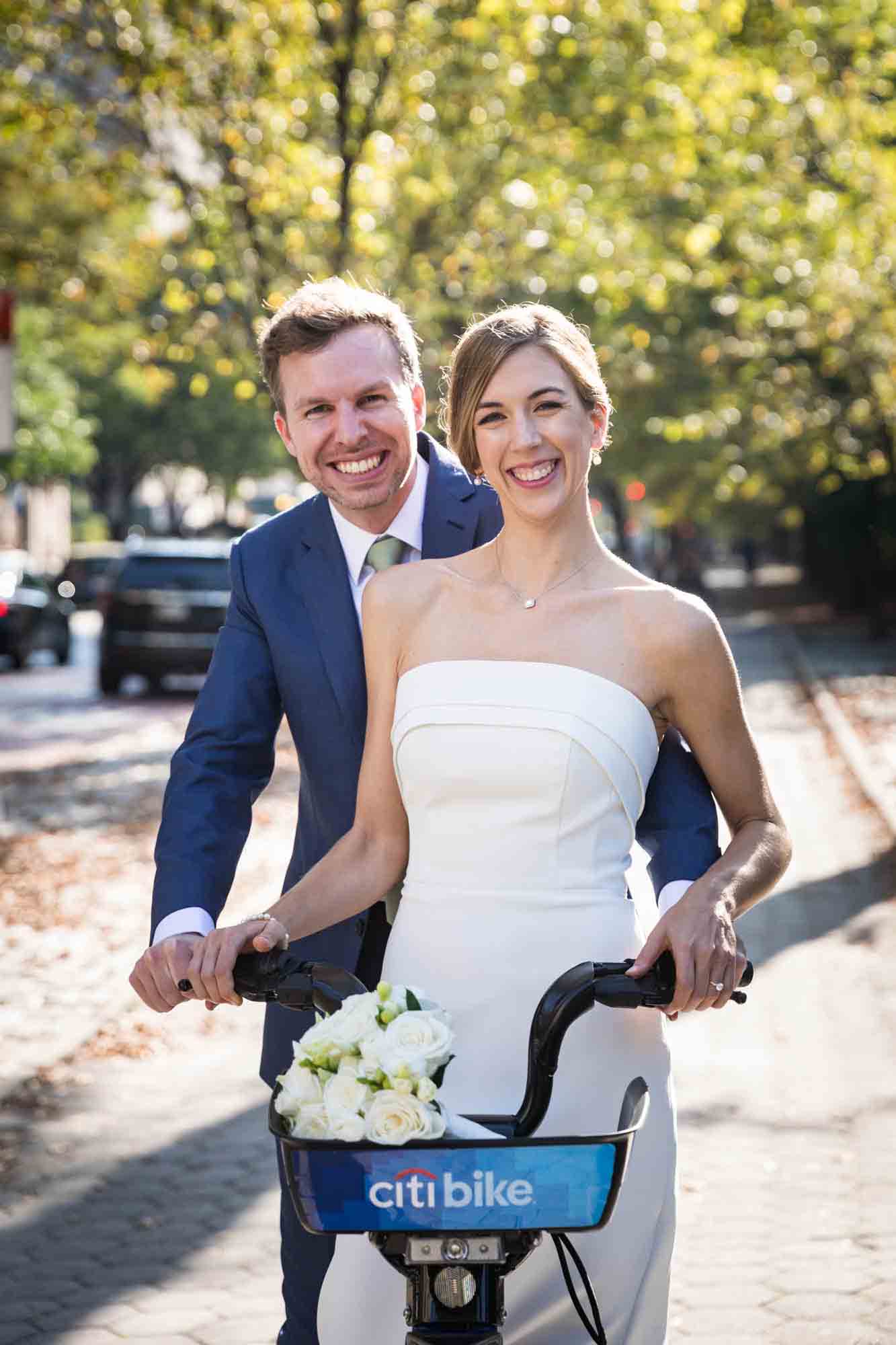 Conservatory Garden wedding photos of bride and groom on back of Citi Bike