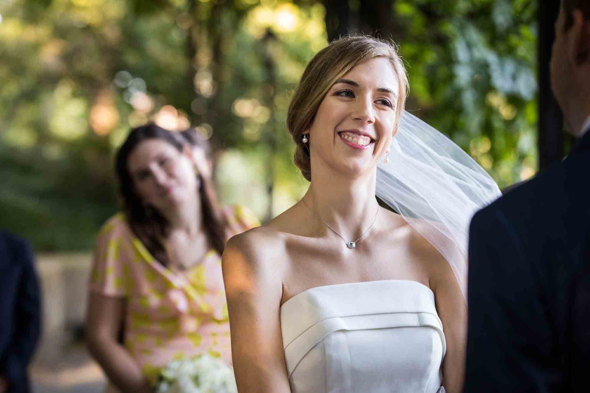 Bride laughing with veil blowing during a Conservatory Garden wedding in Central Park
