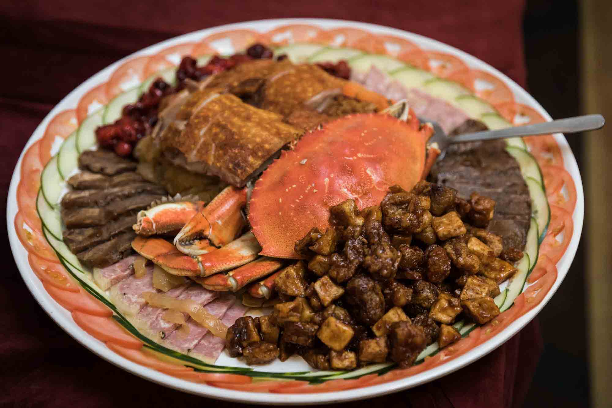 Chinese plate served with food including crab at a Sheraton LaGuardia East Hotel wedding