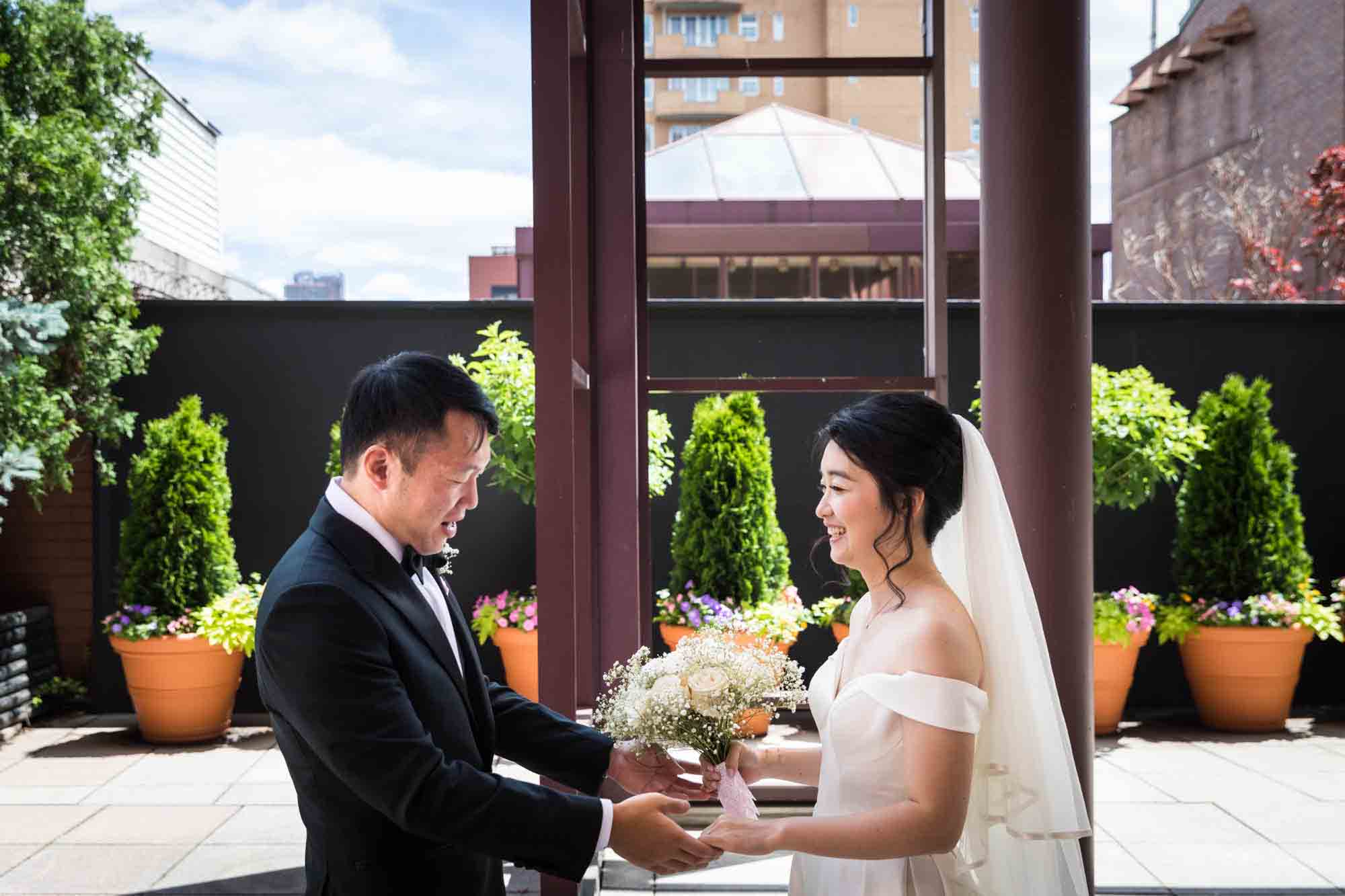 Groom seeing bride in dress for first time at a Sheraton LaGuardia East Hotel wedding
