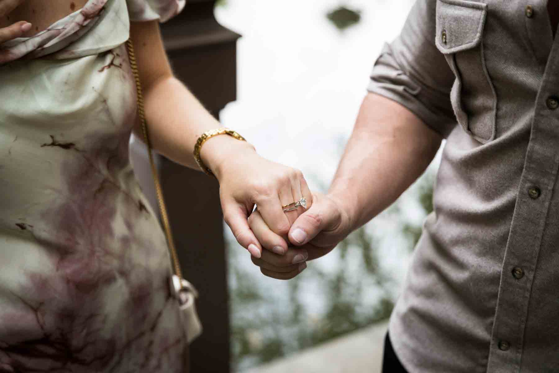 Close up of couple holding hands for an article on the best places to propose in Central Park 