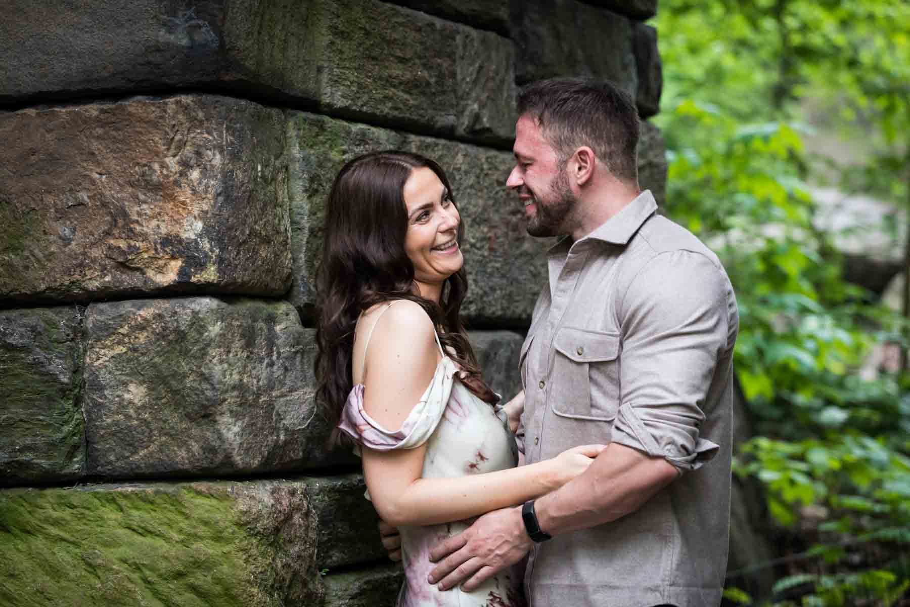 Couple standing in stone archway for an article on the best places to propose in Central Park