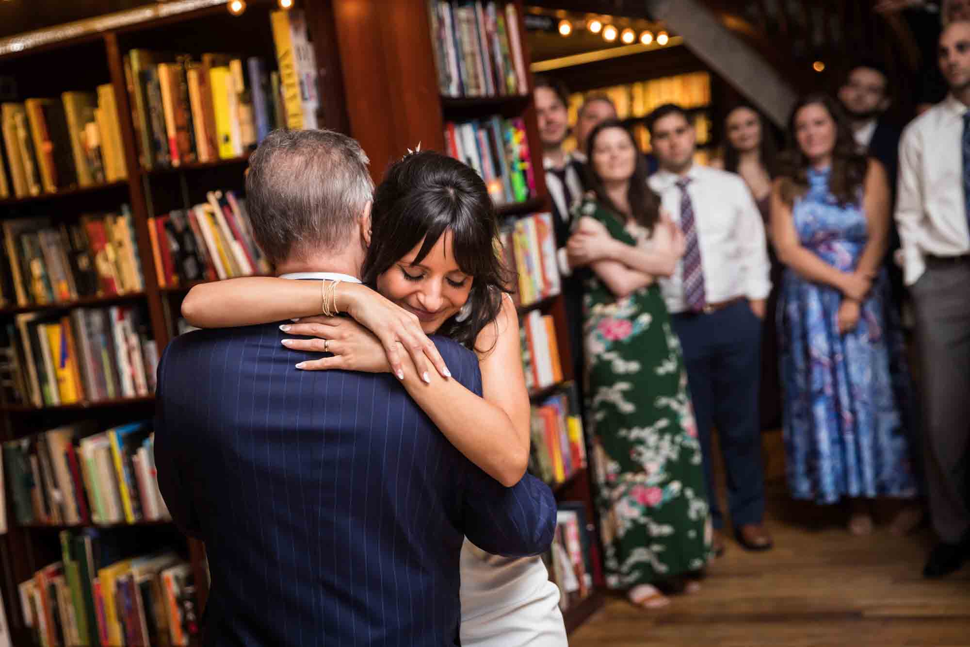 Bride hugging father in front of guests during a Housing Works wedding