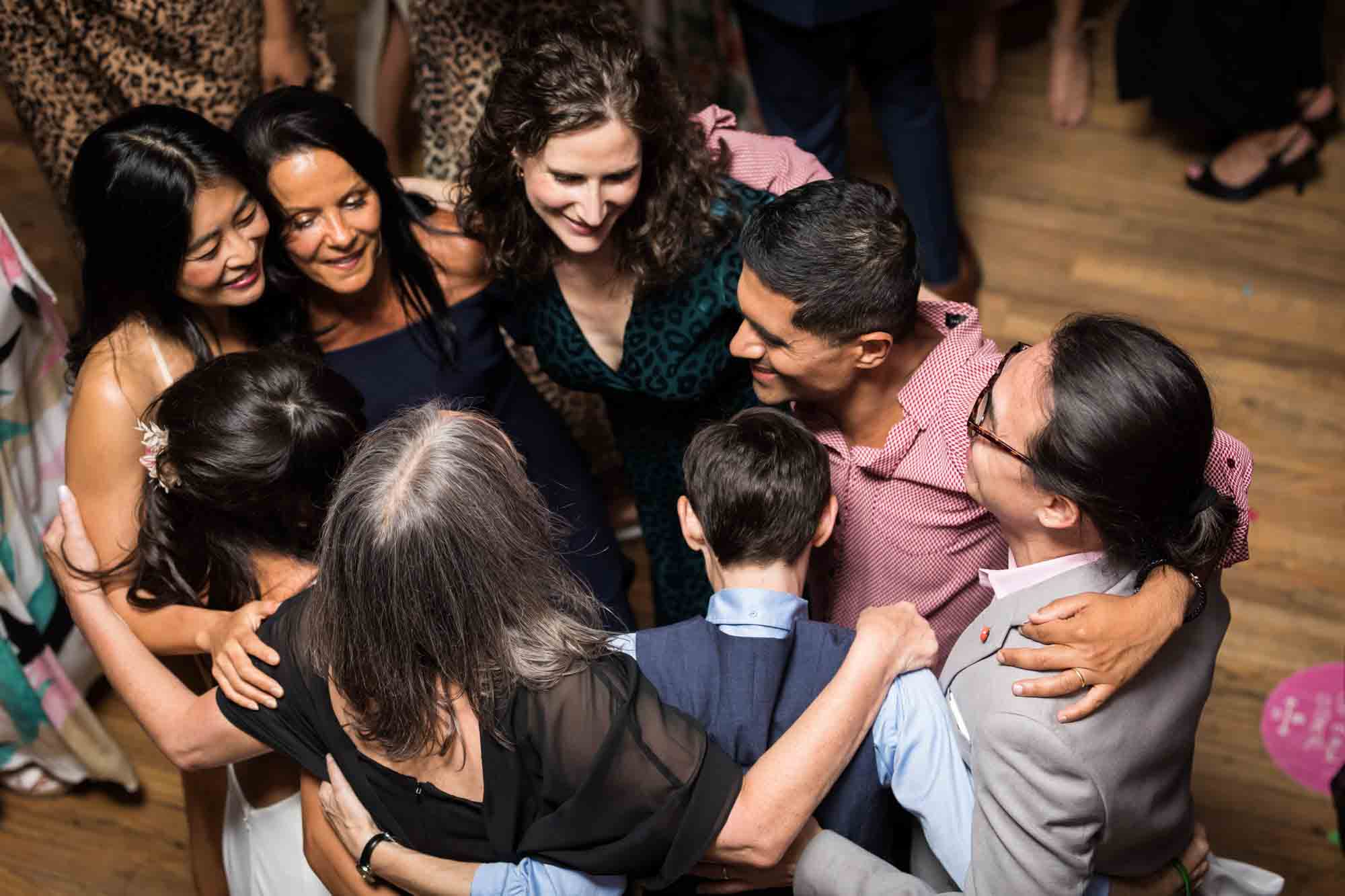 Guests dancing in a circle on the dance floor at a Housing Works wedding