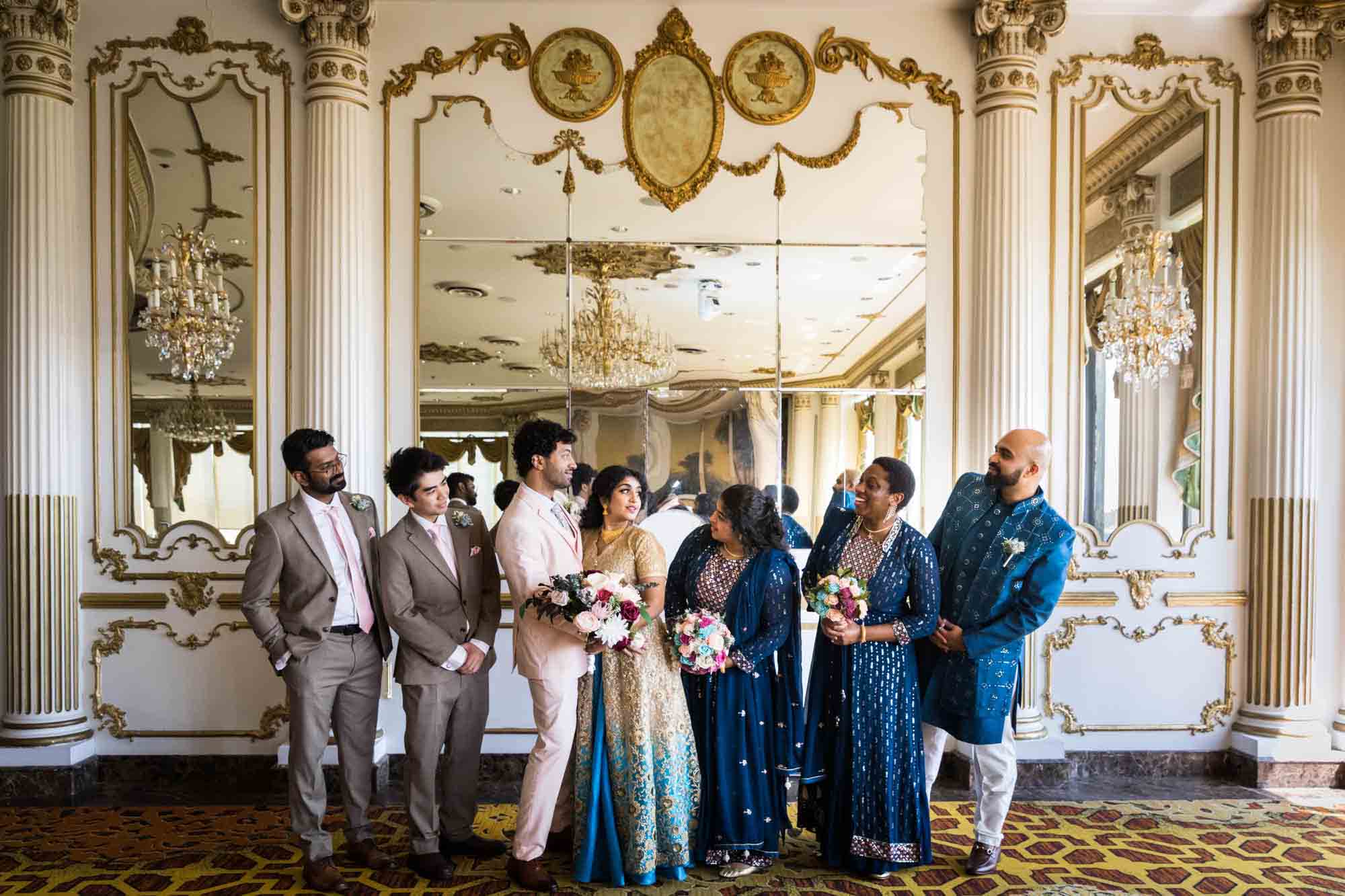 Indian bride and groom and bridal party in front of mirror during a Terrace on the Park wedding