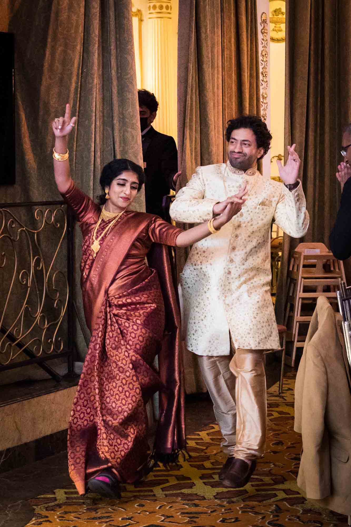 Indian bride and groom making dance introduction into reception during a Terrace on the Park wedding