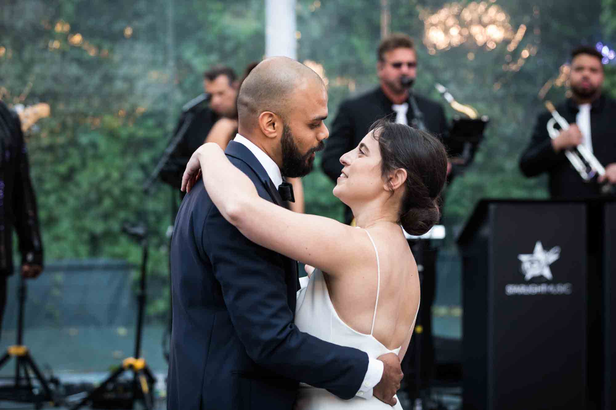 Bride and groom dancing in front of band at a Sanctuary Roosevelt Island wedding