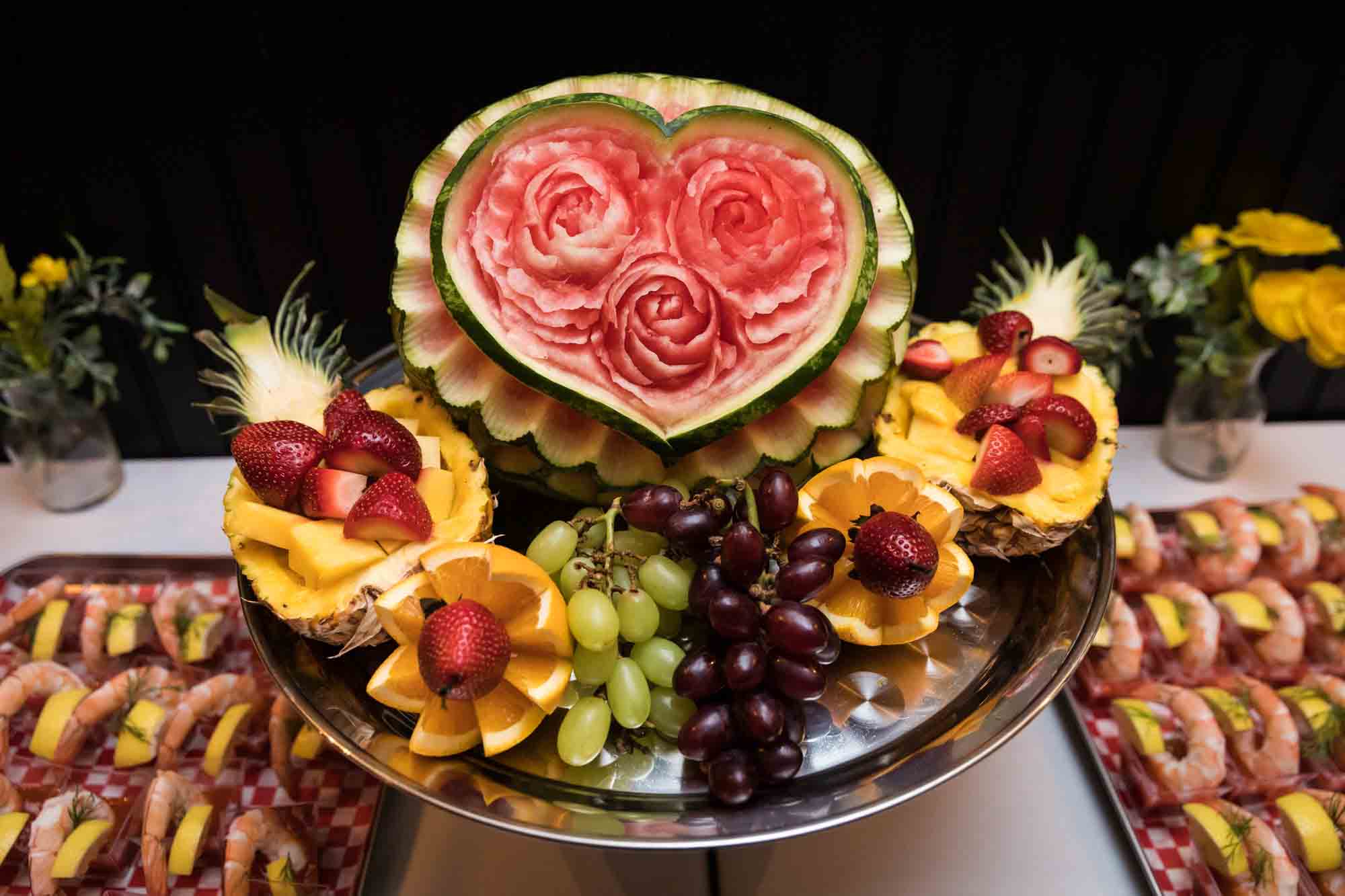 Carved fruit display featuring watermelon and grapes