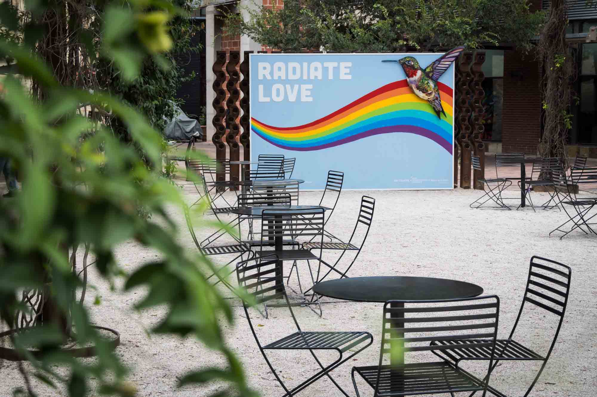 Rainbow billboard with hummingbird at a patio in The Pearl in San Antonio