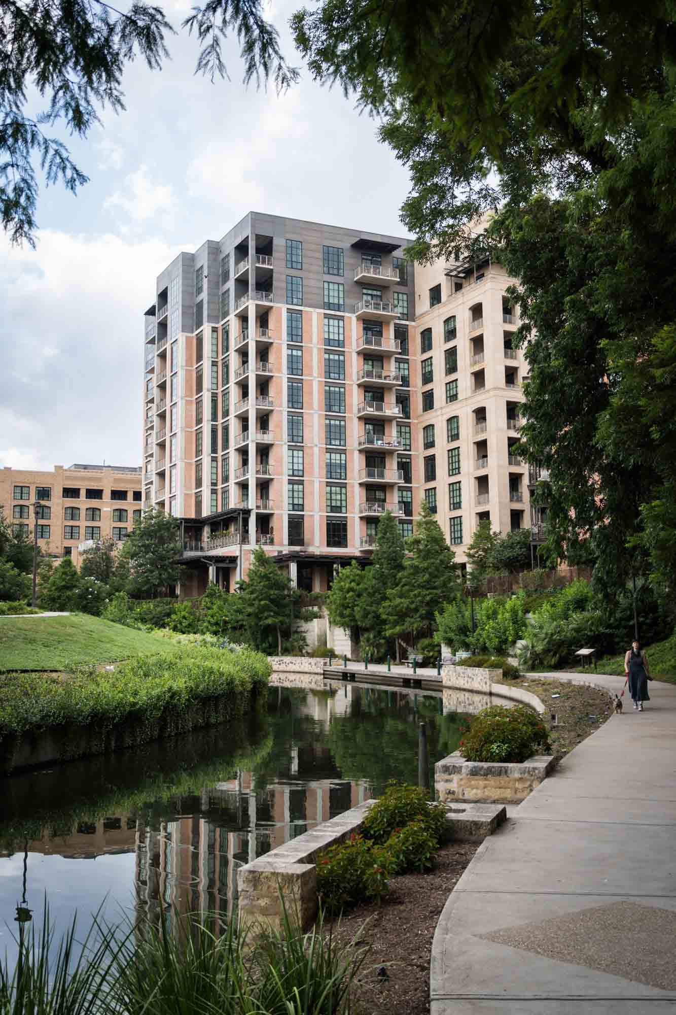 Building and sidewalk along the Riverwalk in San Antonio