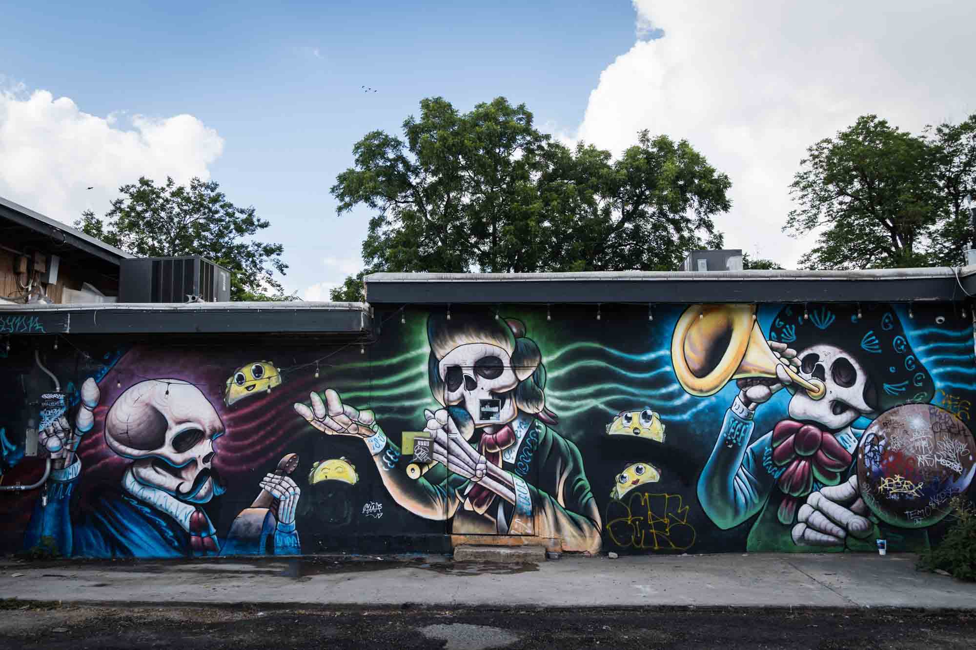 Colorful mural of skeletons playing music in San Antonio