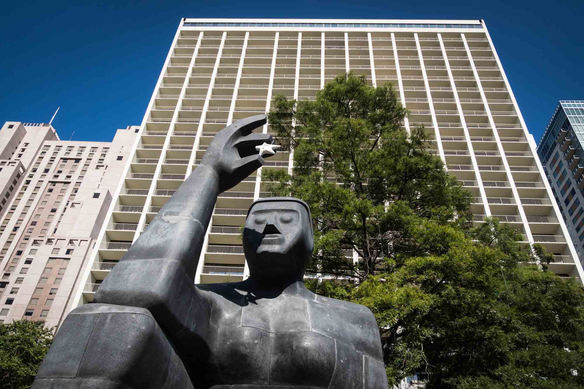 Stargazer statue in front of building in San Antonio