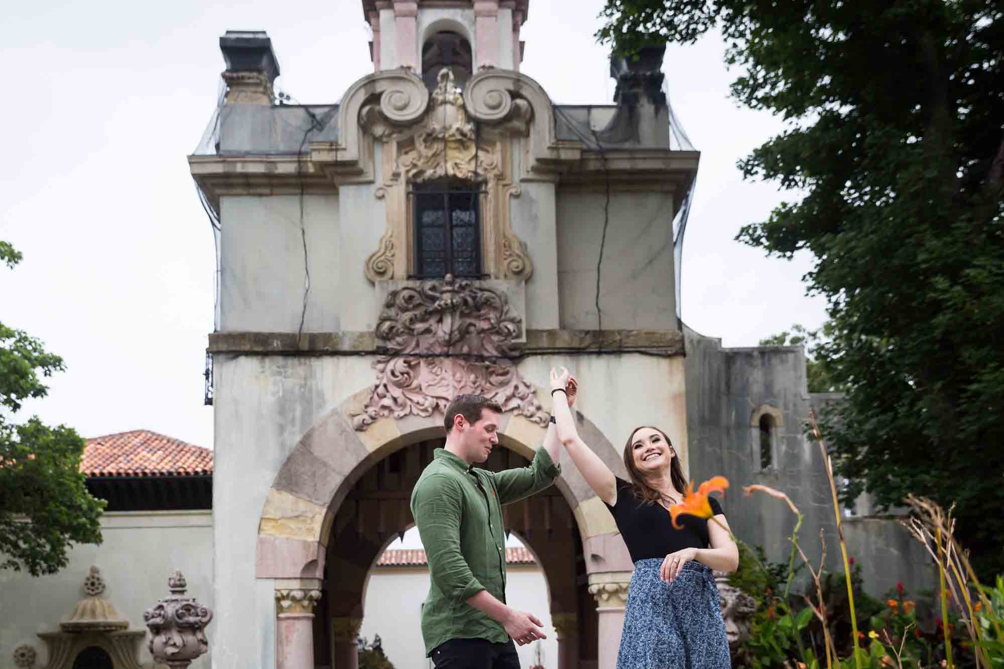 Couple dancing in front of gate at the Vanderbilt Museum