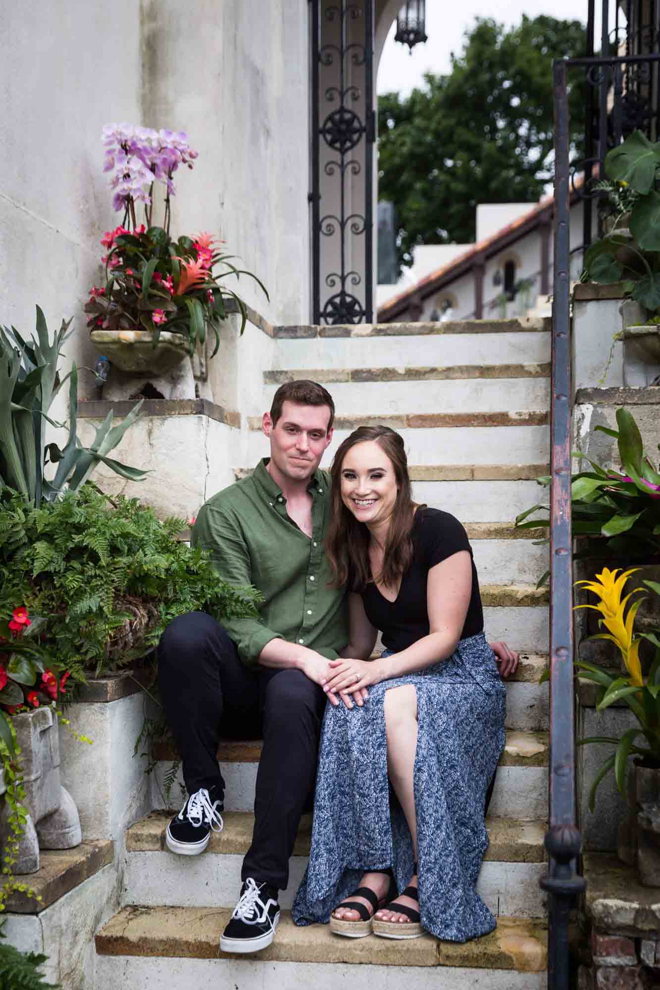 Couple sitting on staircase at the Vanderbilt Museum