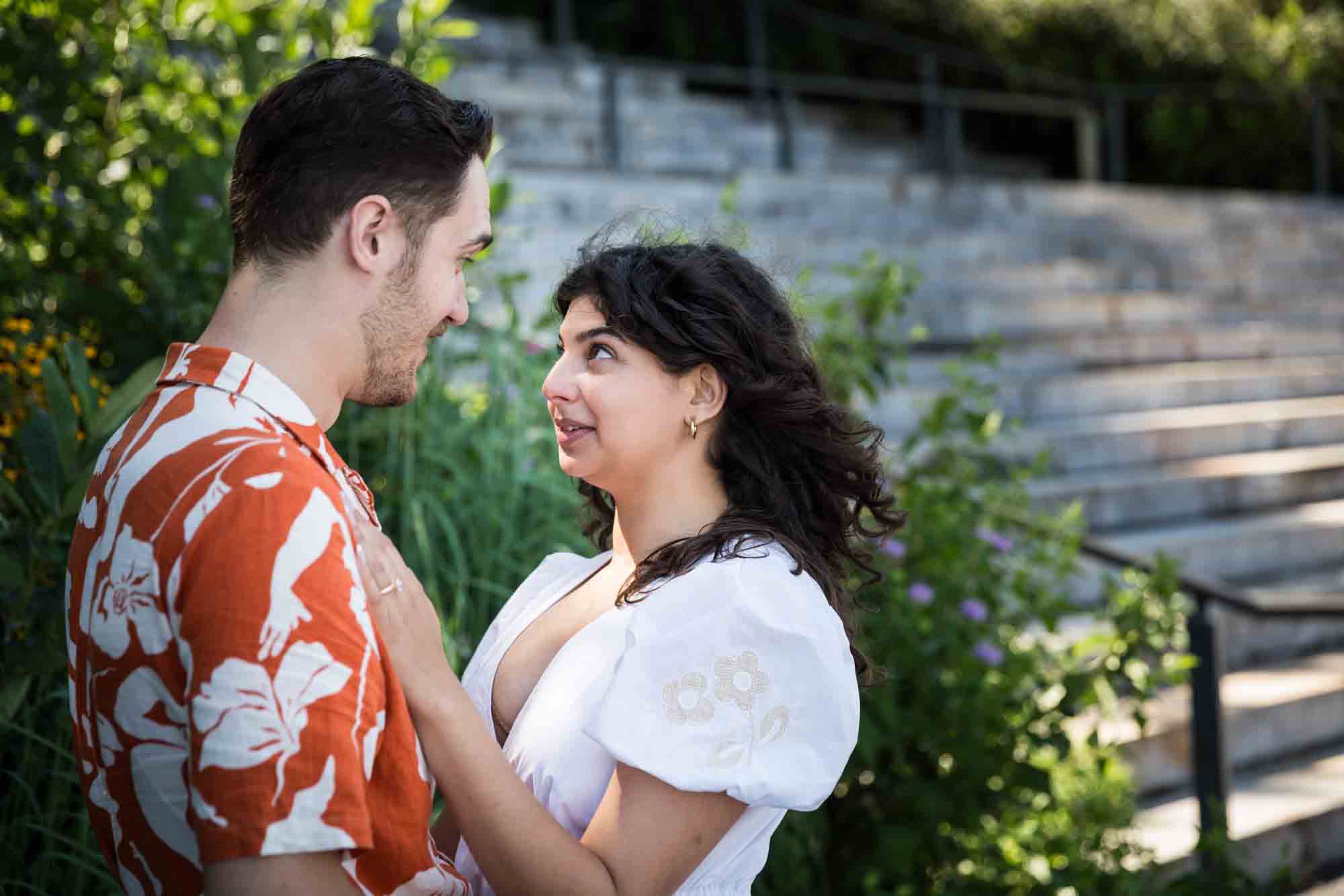 Couple looking at each other in front of Granite Steps in Brooklyn Bridge Park