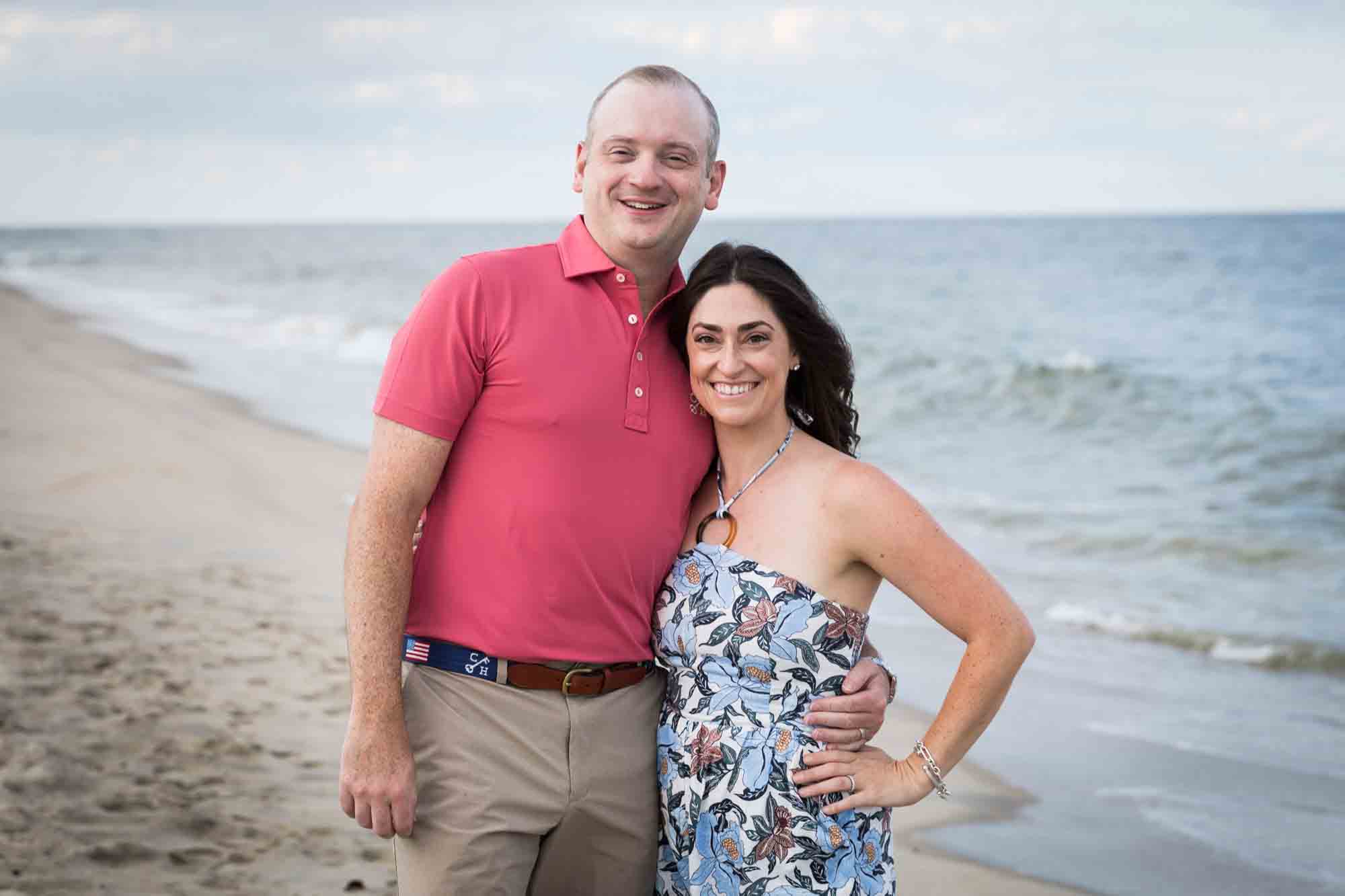 Parents standing on the beach for an article on how to get the best beach photos