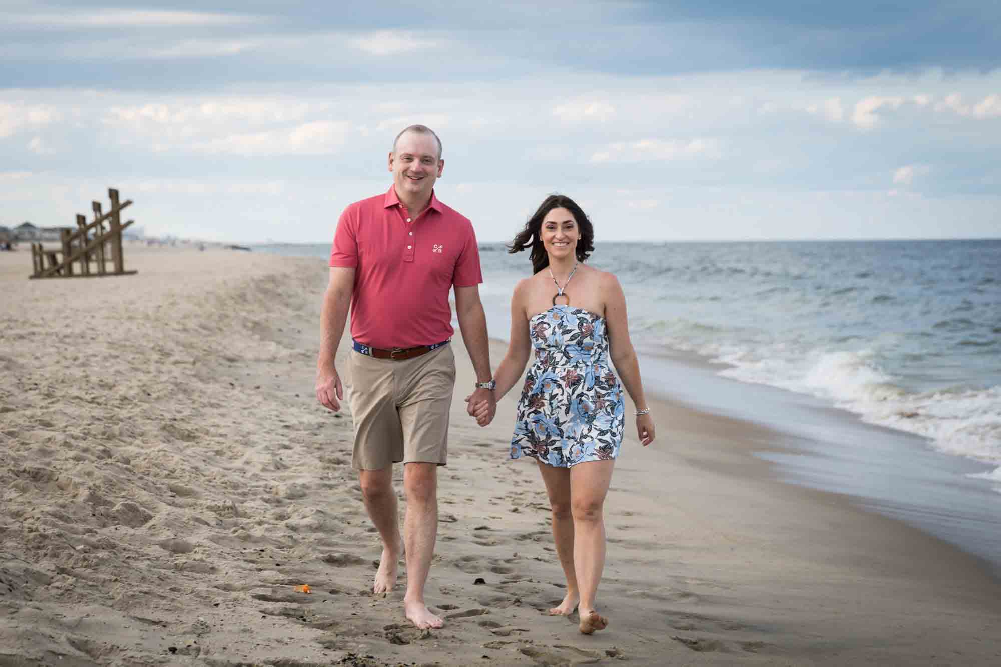 Parents walking on the beach for an article on how to get the best beach photos