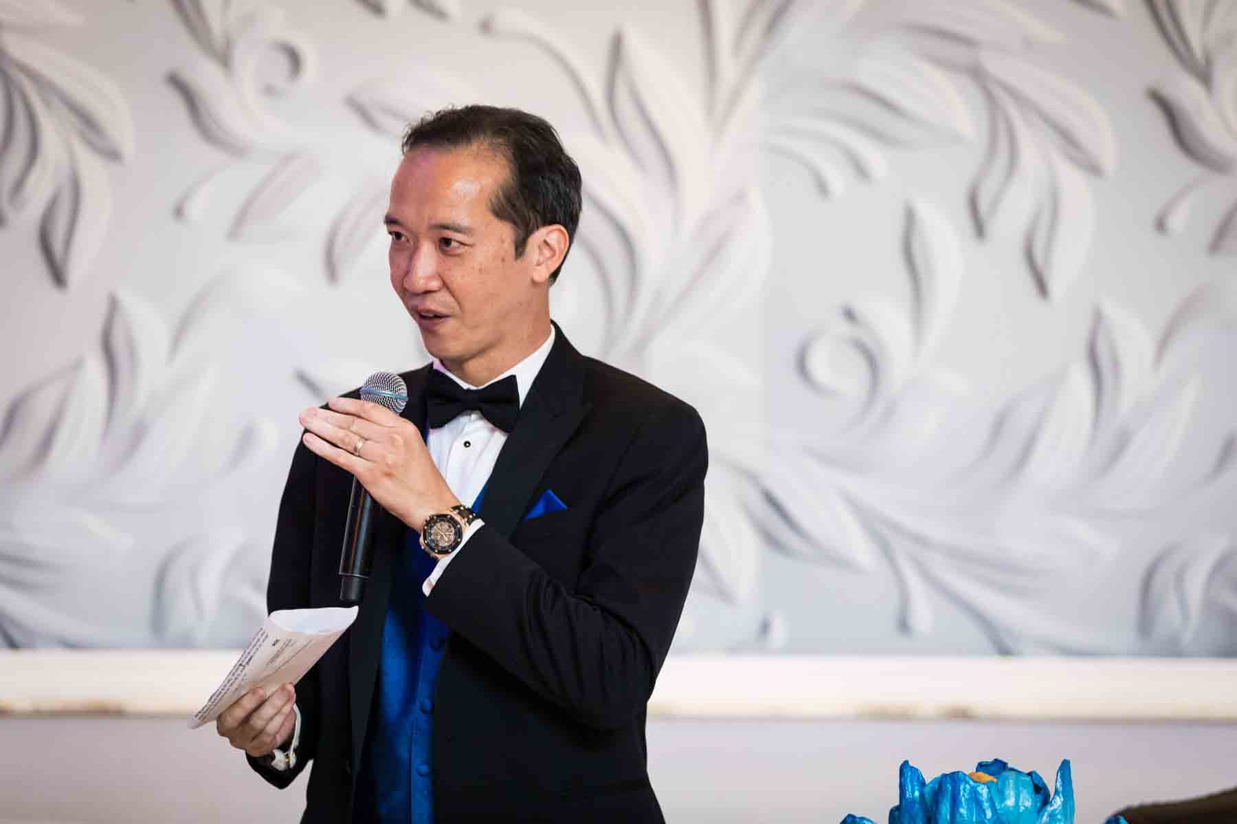 Groom speaking into microphone at a Terrace on the Park wedding