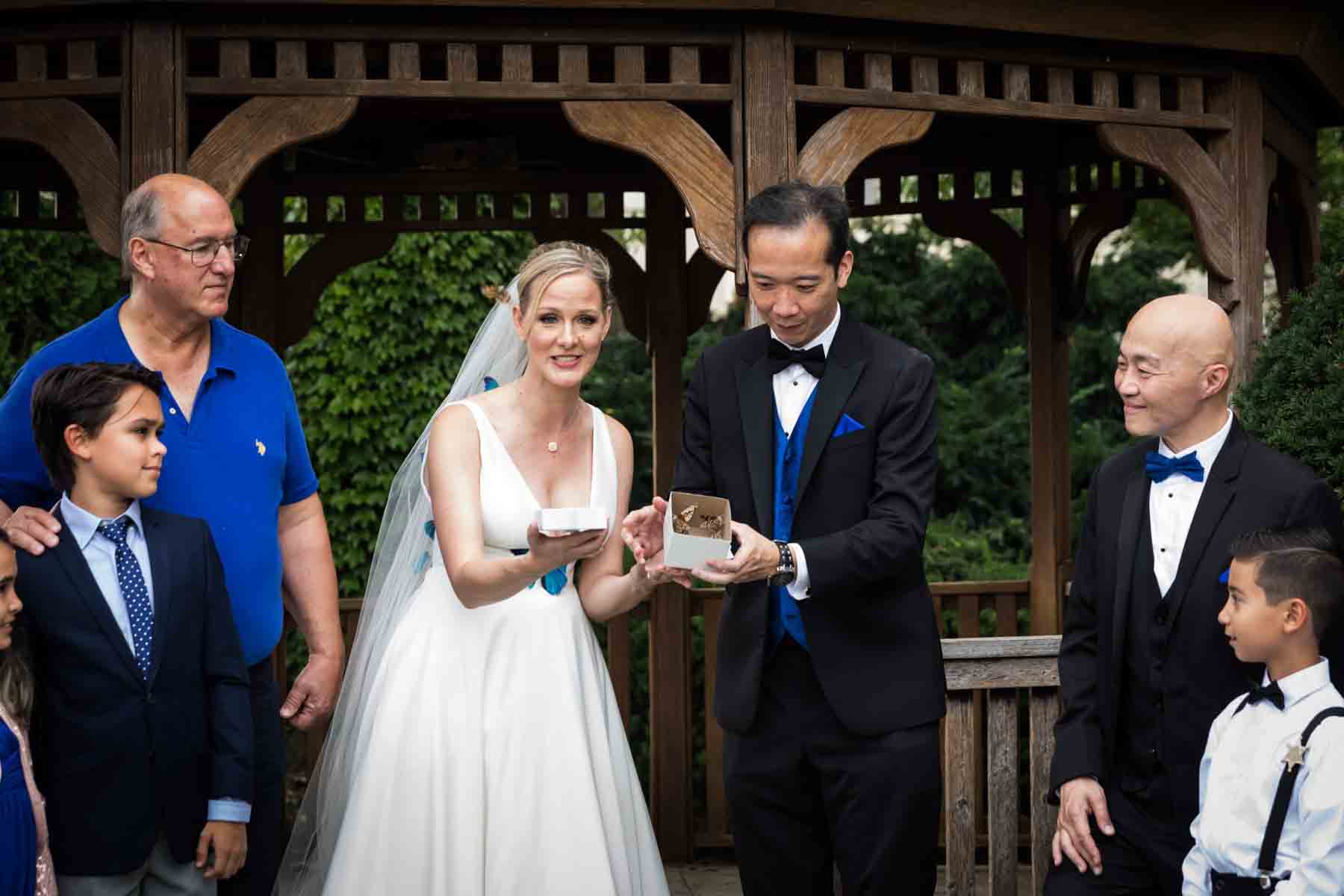 Bride and groom releasing butterflies out of a box at a Terrace on the Park wedding