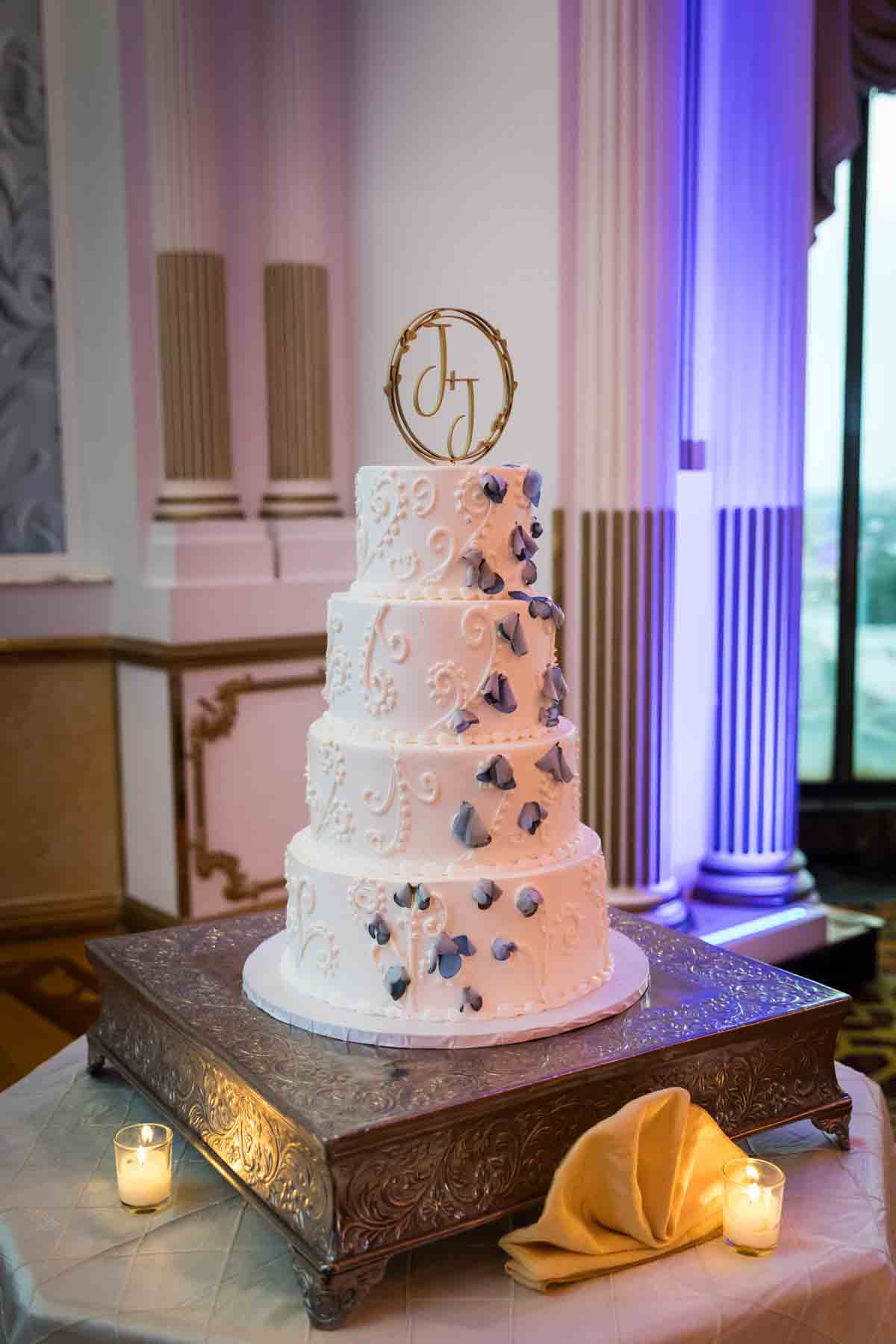 Four layer wedding cake with J+J wedding topper at a Terrace on the Park wedding