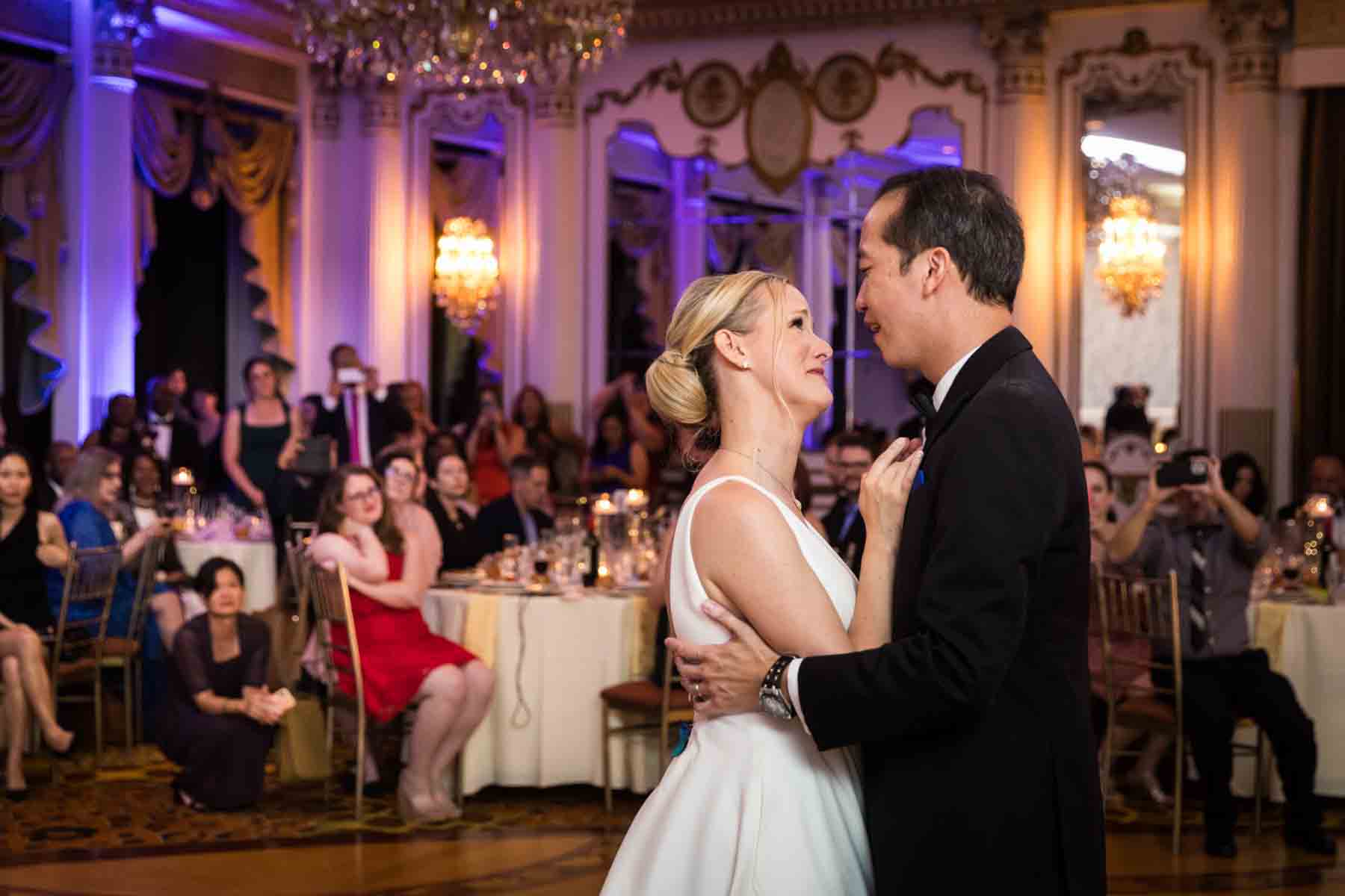 Couple dancing in front of guests during first dance at a Terrace on the Park wedding