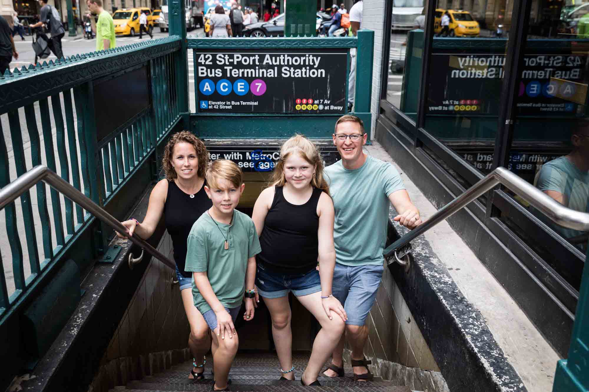 Parents and two kids posed in subway stairwell for an article on best Manhattan family portrait locations
