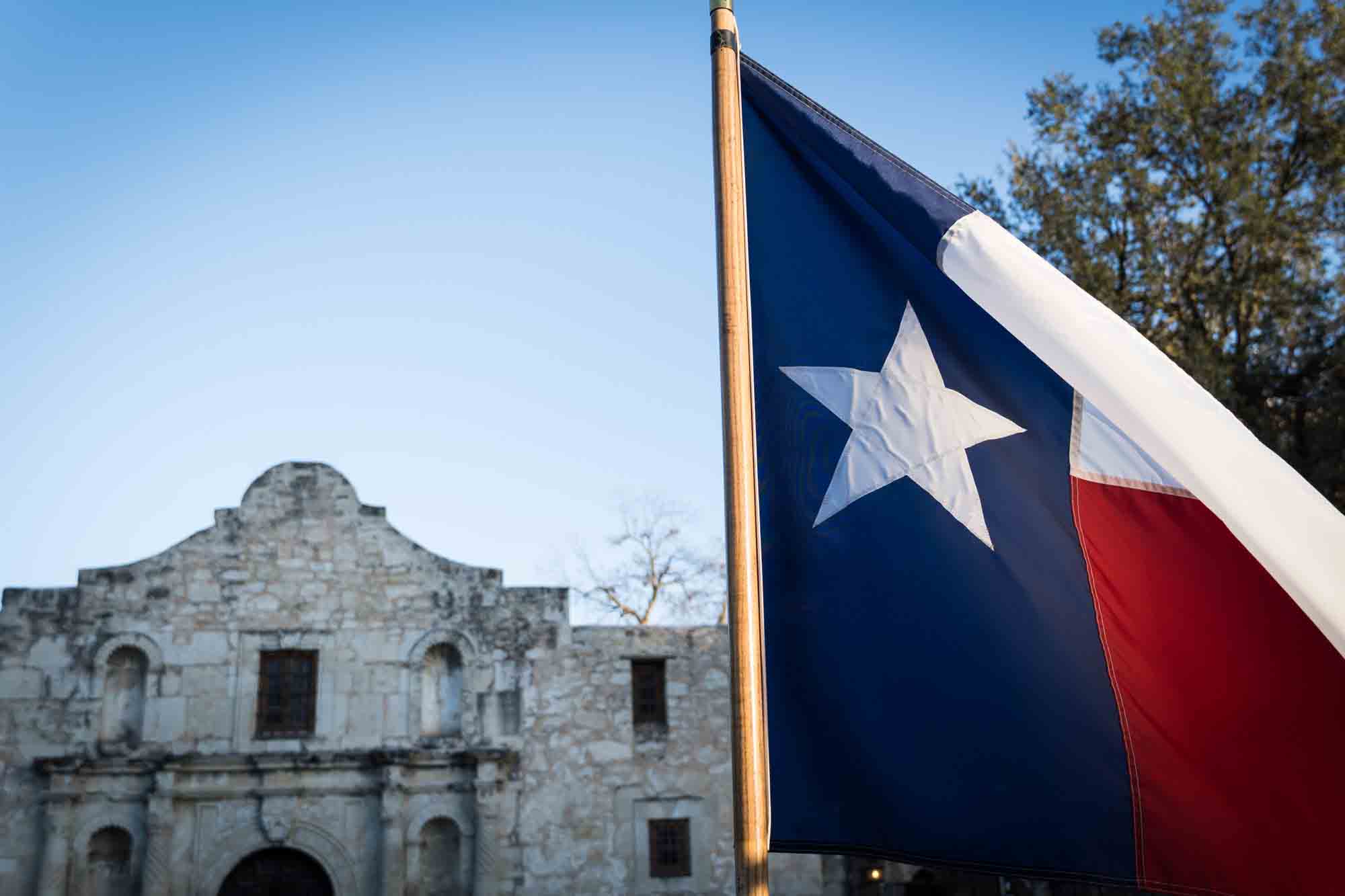Texas flag and Alamo building by San Antonio photographer, Kelly Williams