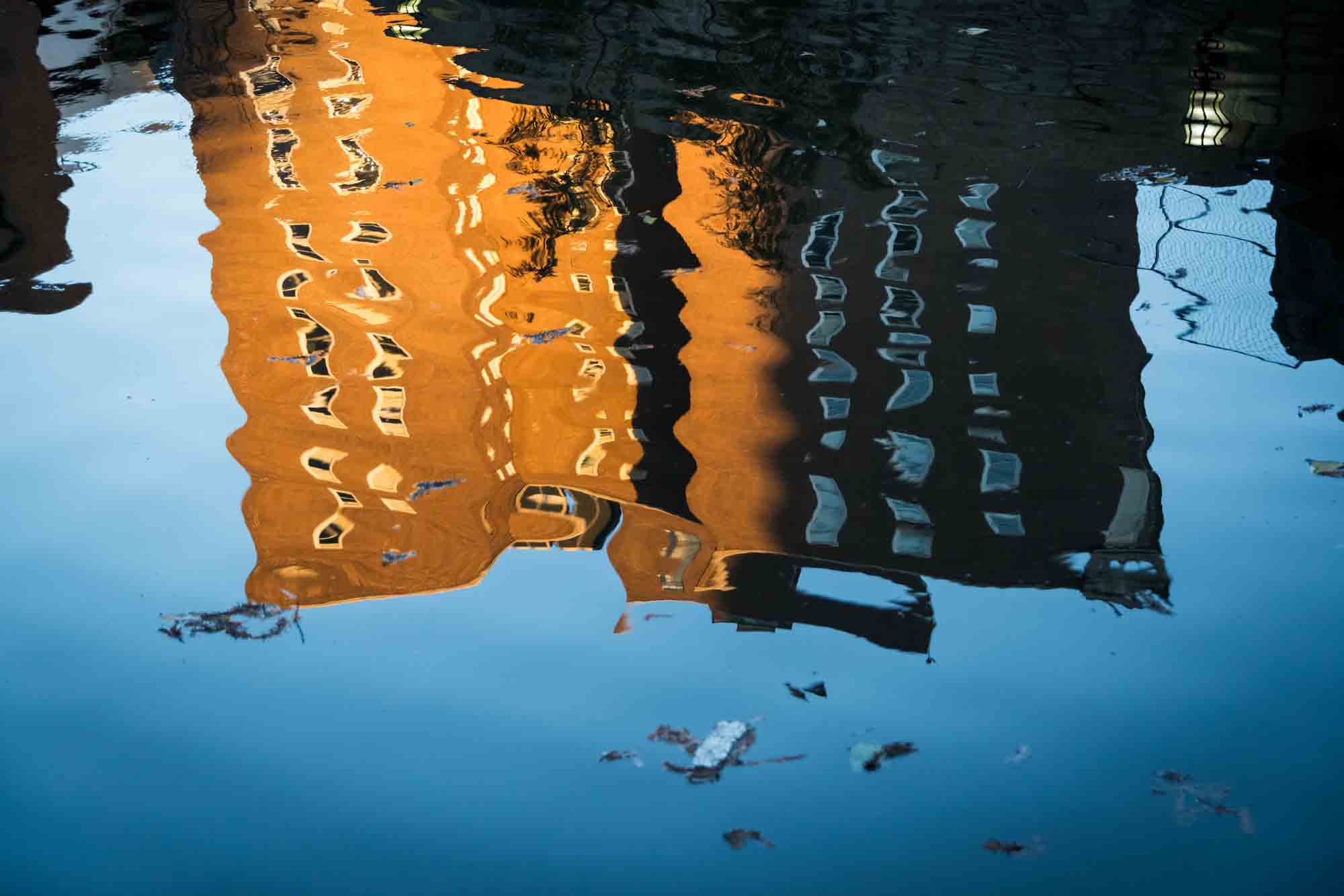 Reflection of building in river by San Antonio photographer, Kelly Williams