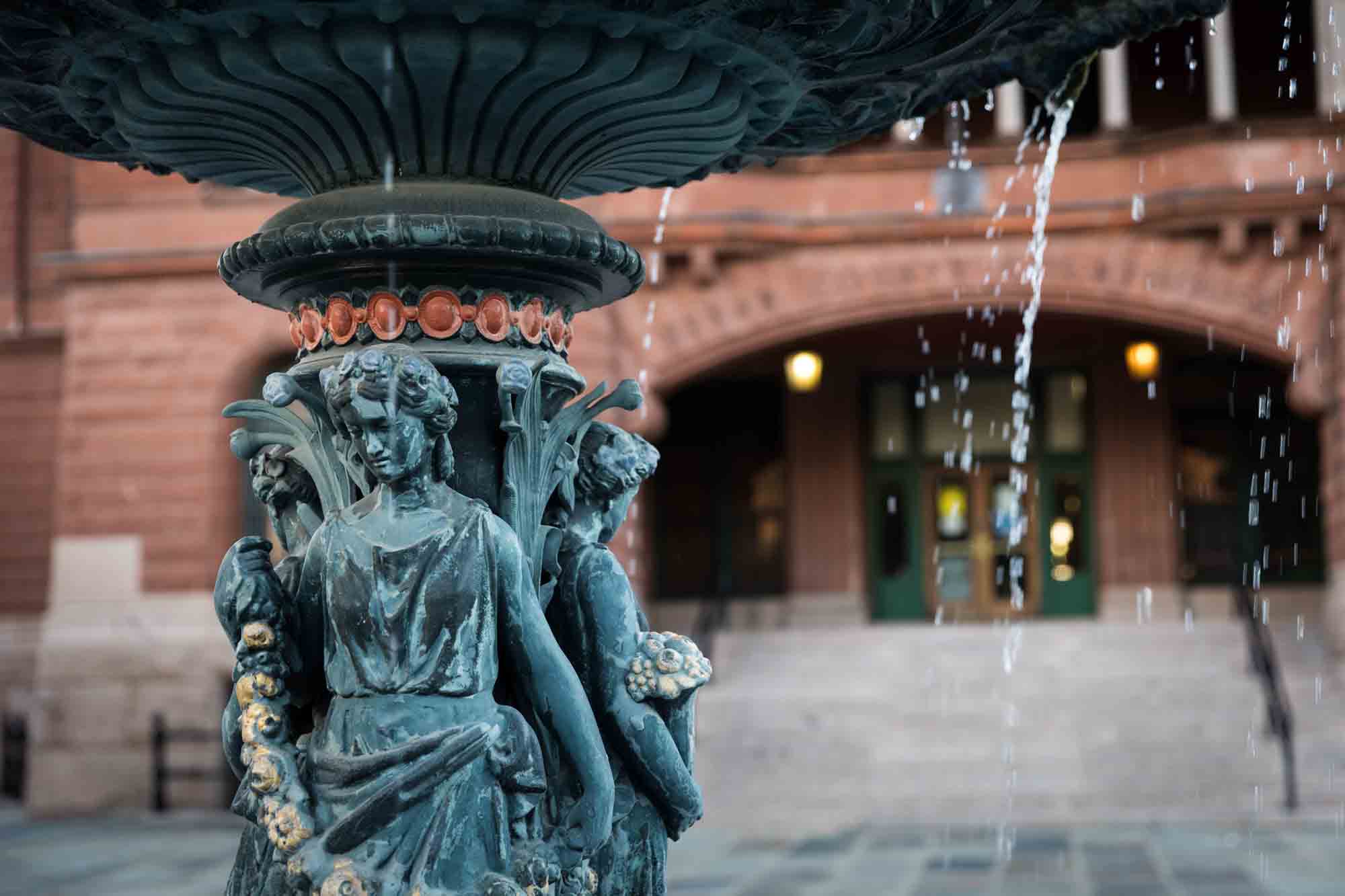 Close up of fountain in front of Bexar Count Courthouse with female sculpted figures for an article on how to get a marriage license in San Antonio