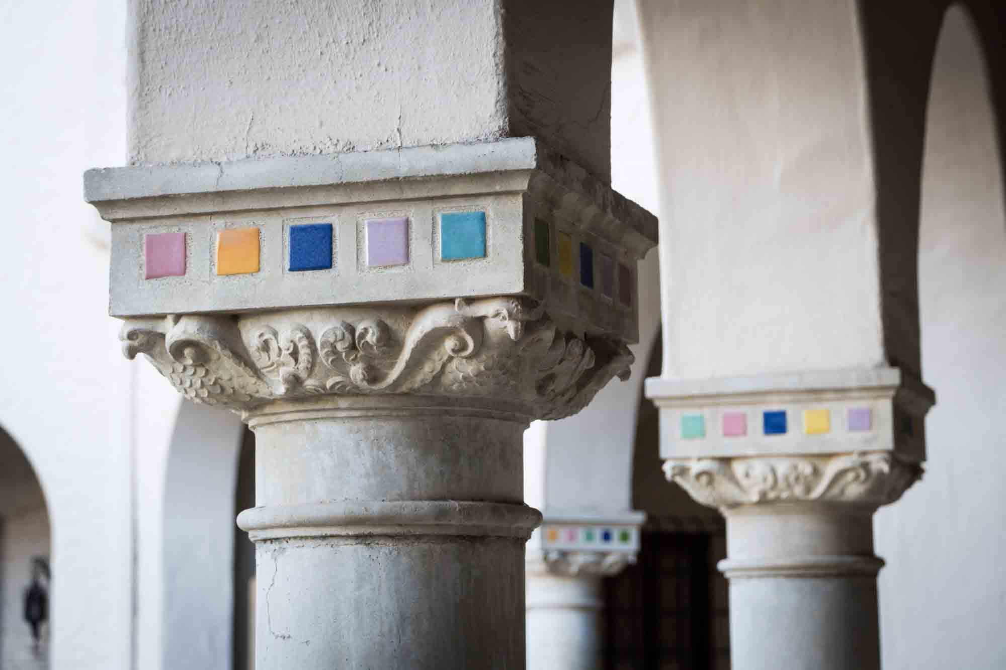 Concrete columns with colorful tile details for an article on how to take photos at the McNay Art Museum