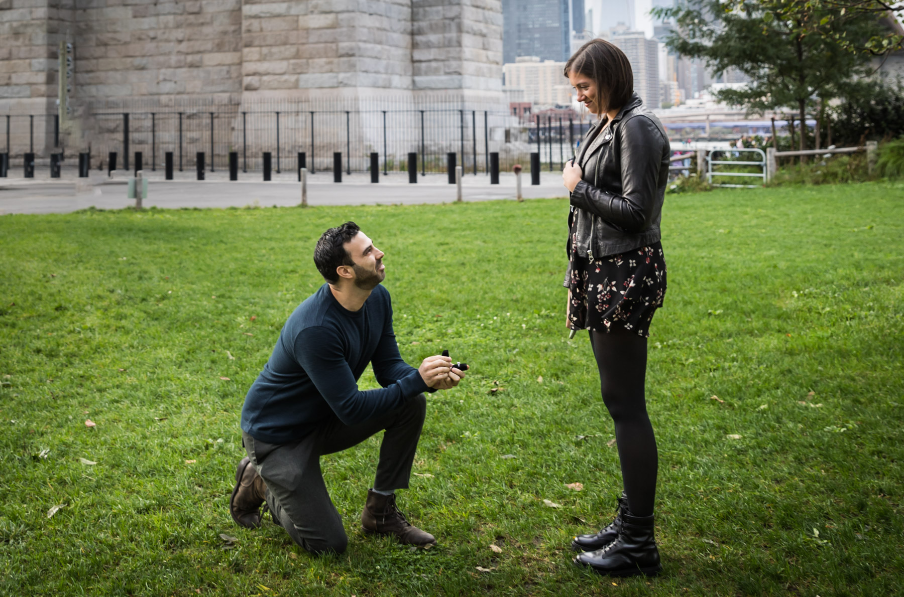 Man down on one knee asking woman to marry him for an article on how to propose at the Tower of the Americas