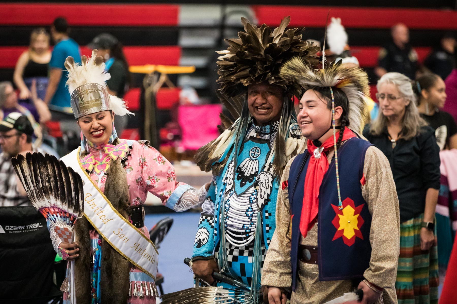 American Indians laughing and walking during pow wow for an article on the best Fiesta photos