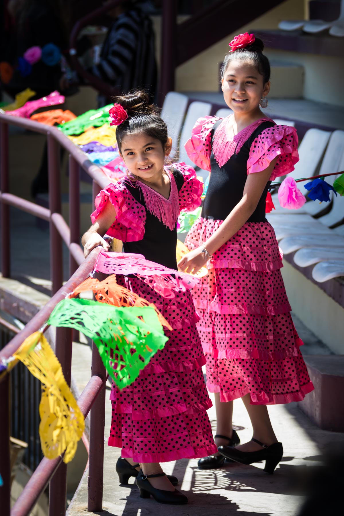 Little dancers wearing pink and black dresses during Day at Old Mexico for an article on the best Fiesta photos
