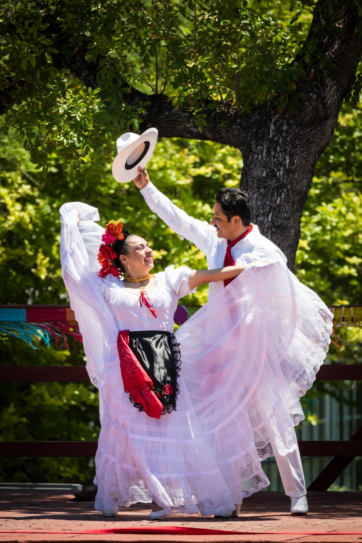 Dancers wearing white outfits during Day at Old Mexico for an article on the best Fiesta photos