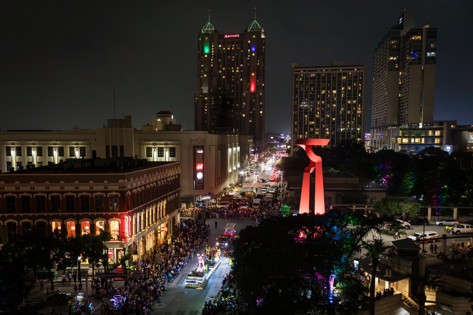 San Antonio at night during the Fiesta Flambeau parade for an article on the best Fiesta photos