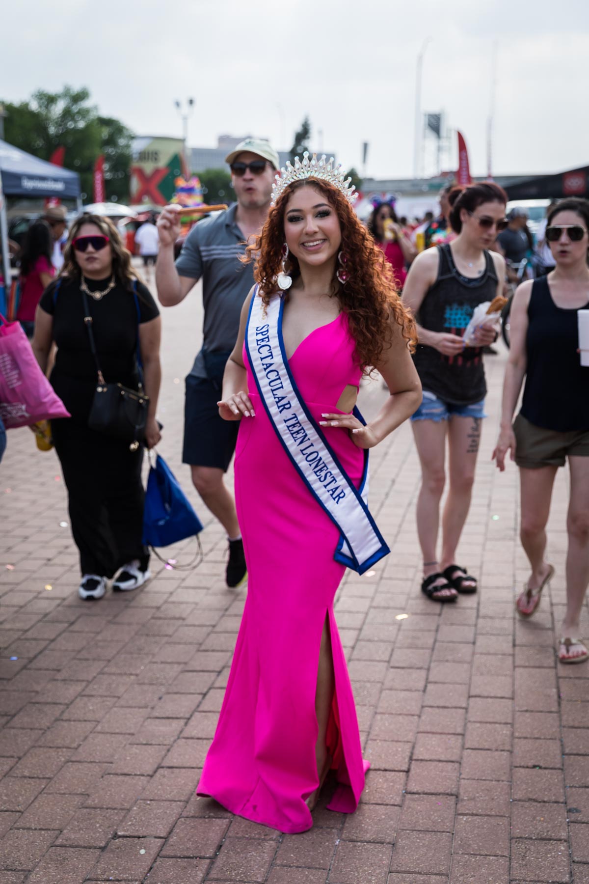 Princess wearing pink dress, sash, and tiara at Fiesta Fiesta for an article on the best Fiesta photos