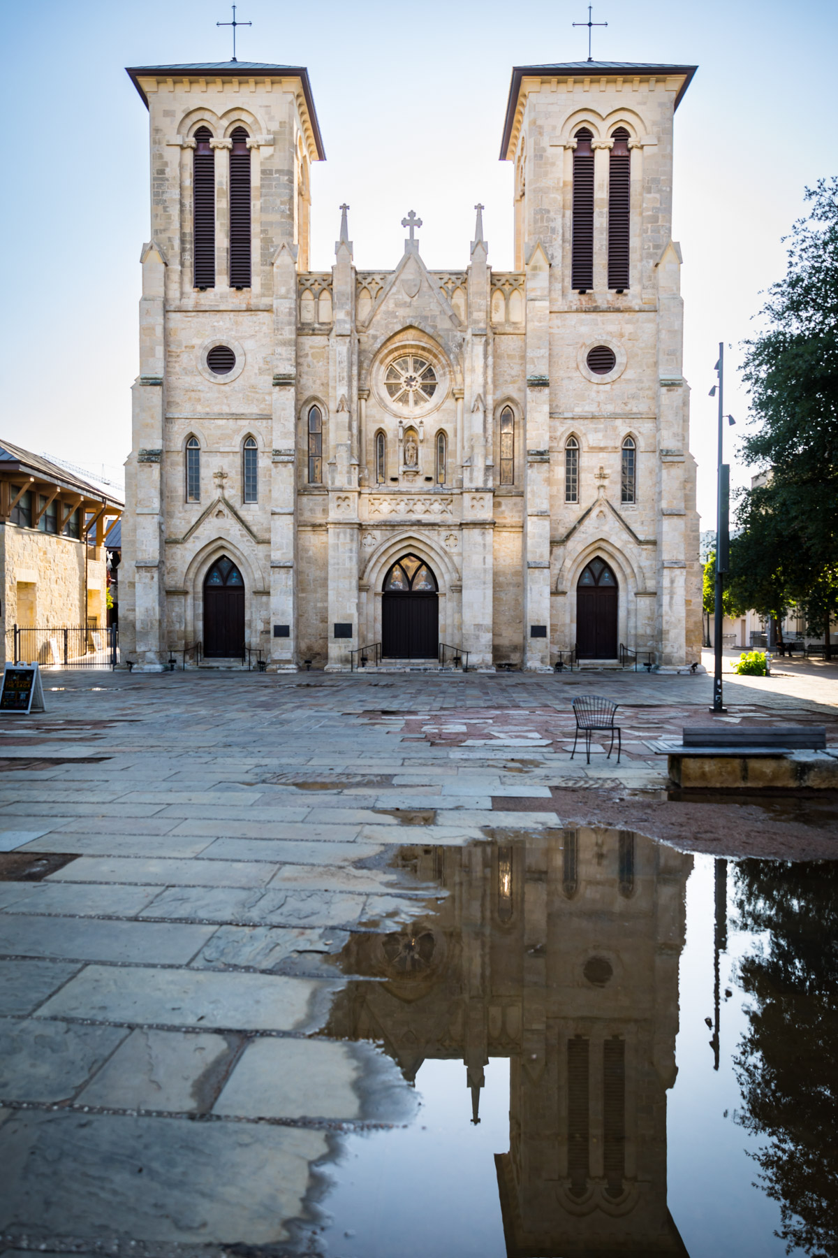 San Fernando Cathedral with water puddle and reflection for an article on the perfect downtown San Antonio family portrait itinerary