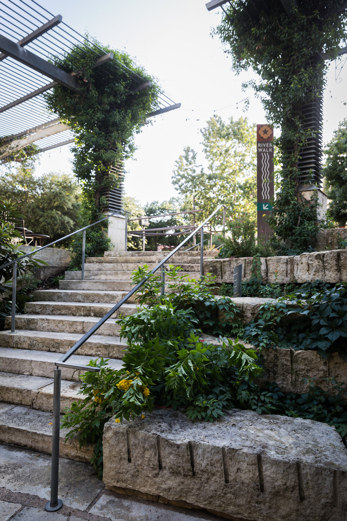 Stone staircase leading to Riverwalk for an article on the perfect downtown San Antonio family portrait itinerary