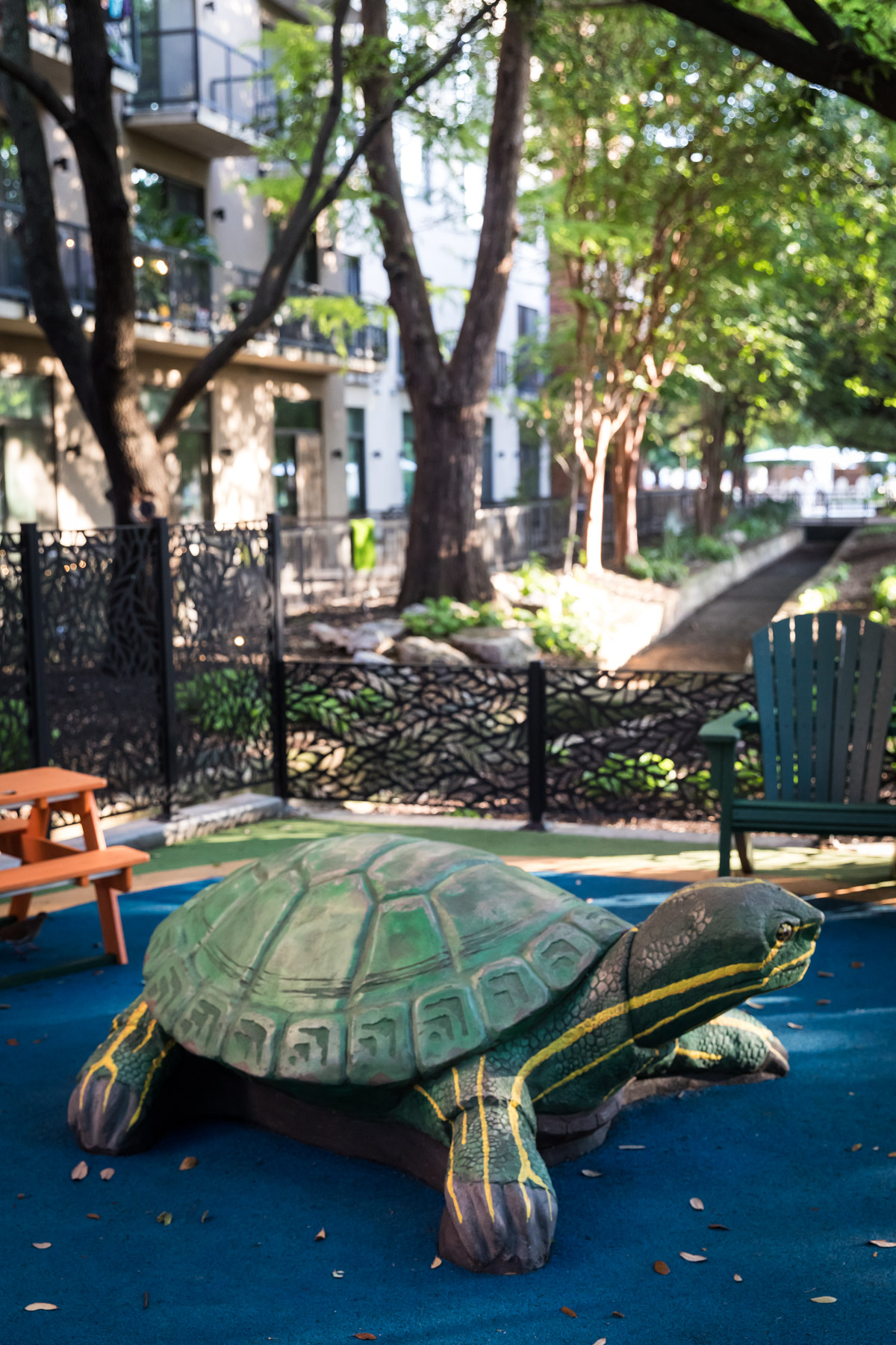Turtle sculpture in playground in Yanaguana Garden in Hemisfair for an article on the perfect downtown San Antonio family portrait itinerary