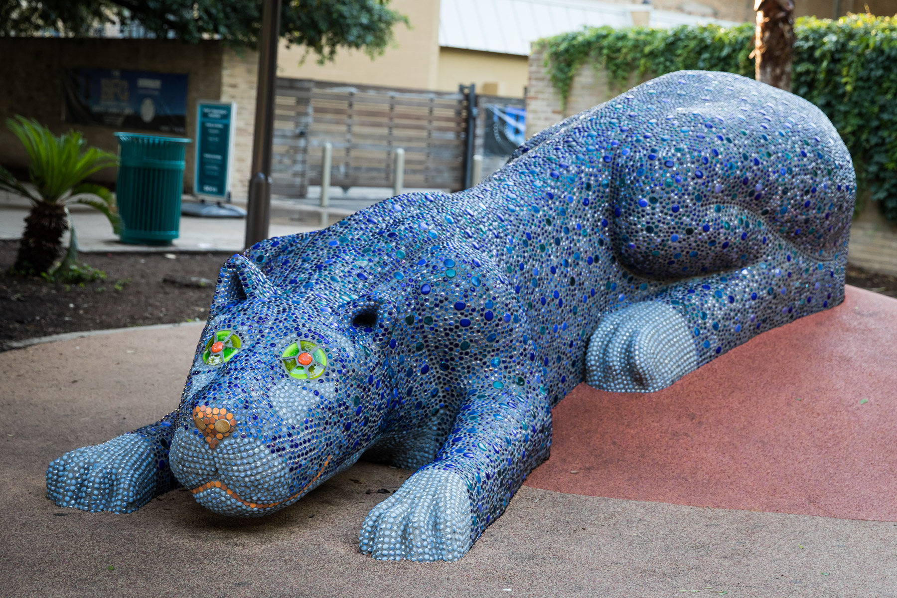 Blue mosaic covered cat sculpture in Yanaguana Garden in Hemisfair for an article on the perfect downtown San Antonio family portrait itinerary