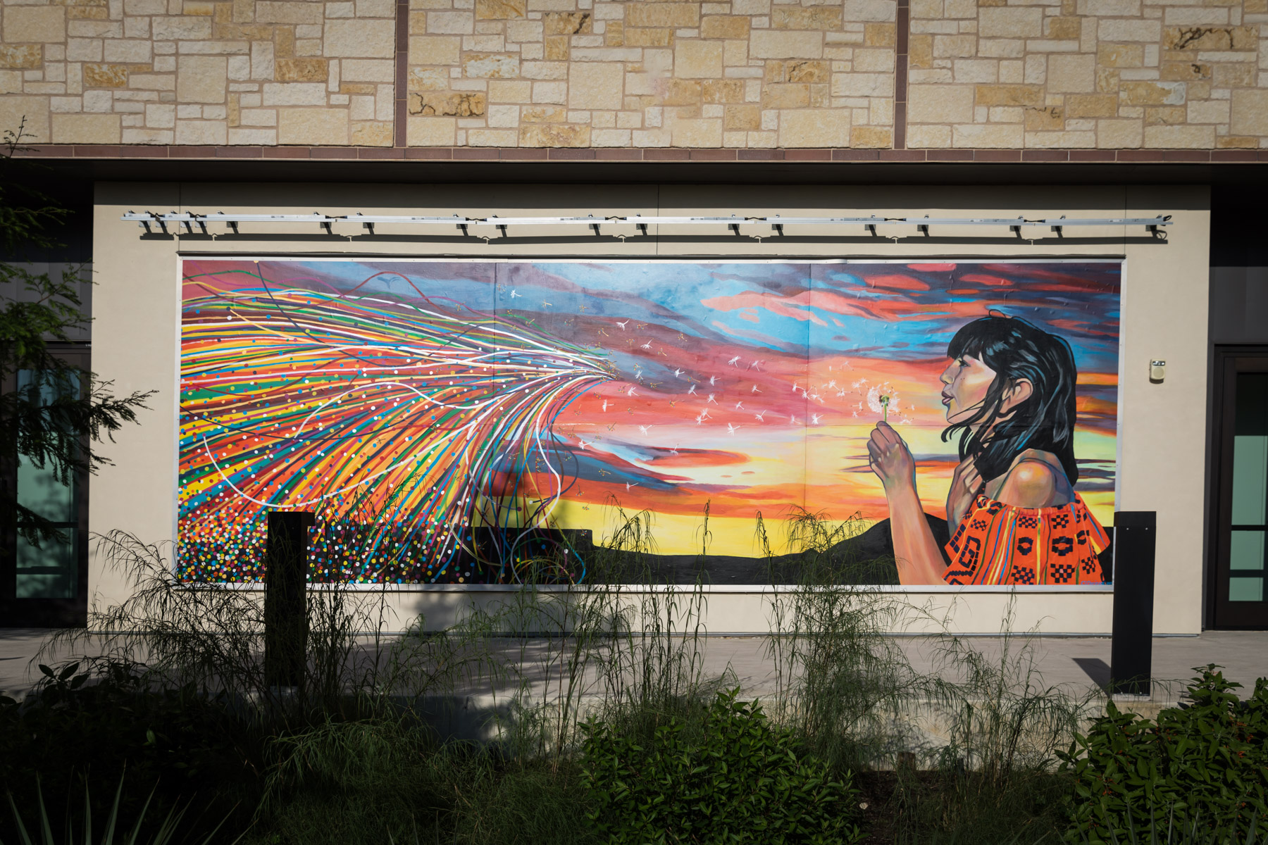 Colorful mural of girl blowing dandelion for an article on the perfect downtown San Antonio family portrait itinerary