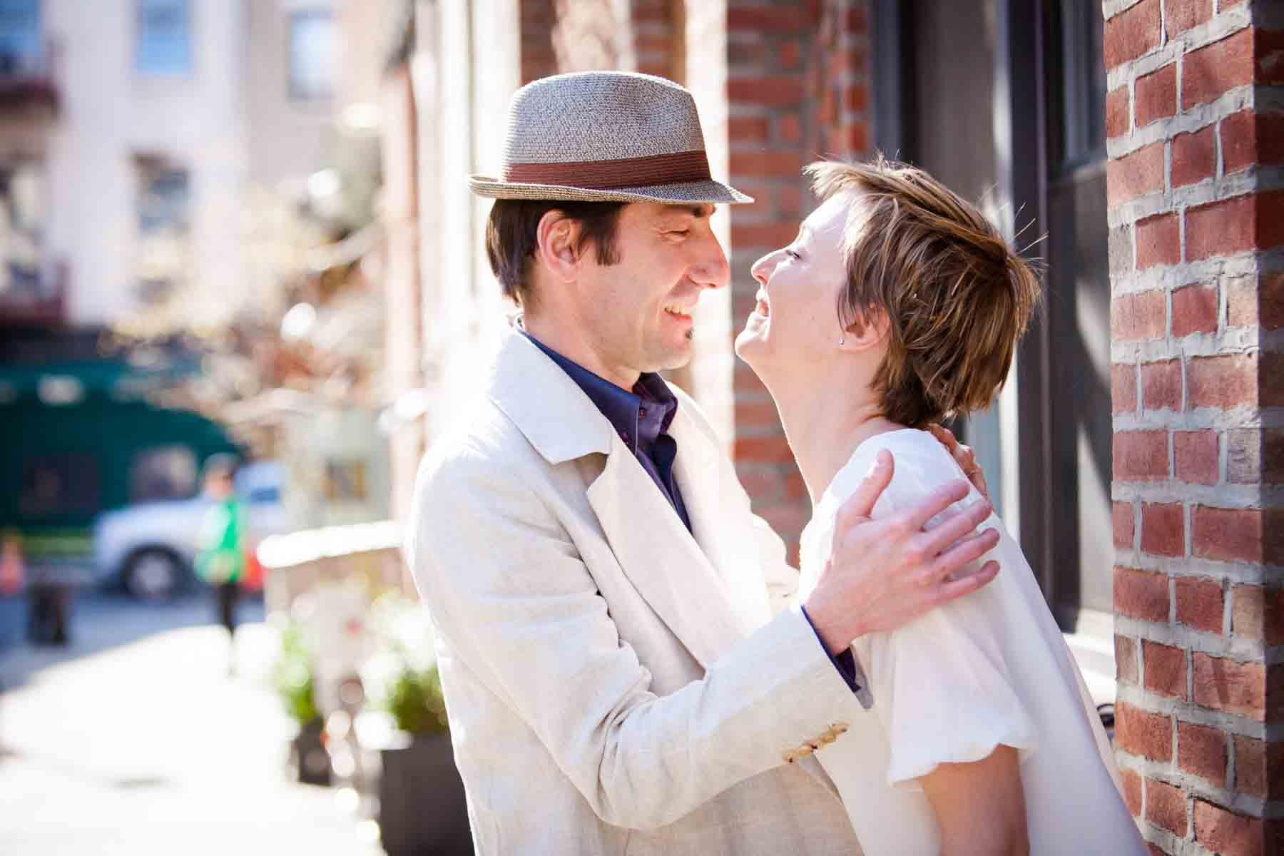 Man grabbing woman with short hair by the shoulders for an article entitled, ‘Are Couples Still Getting Married?’