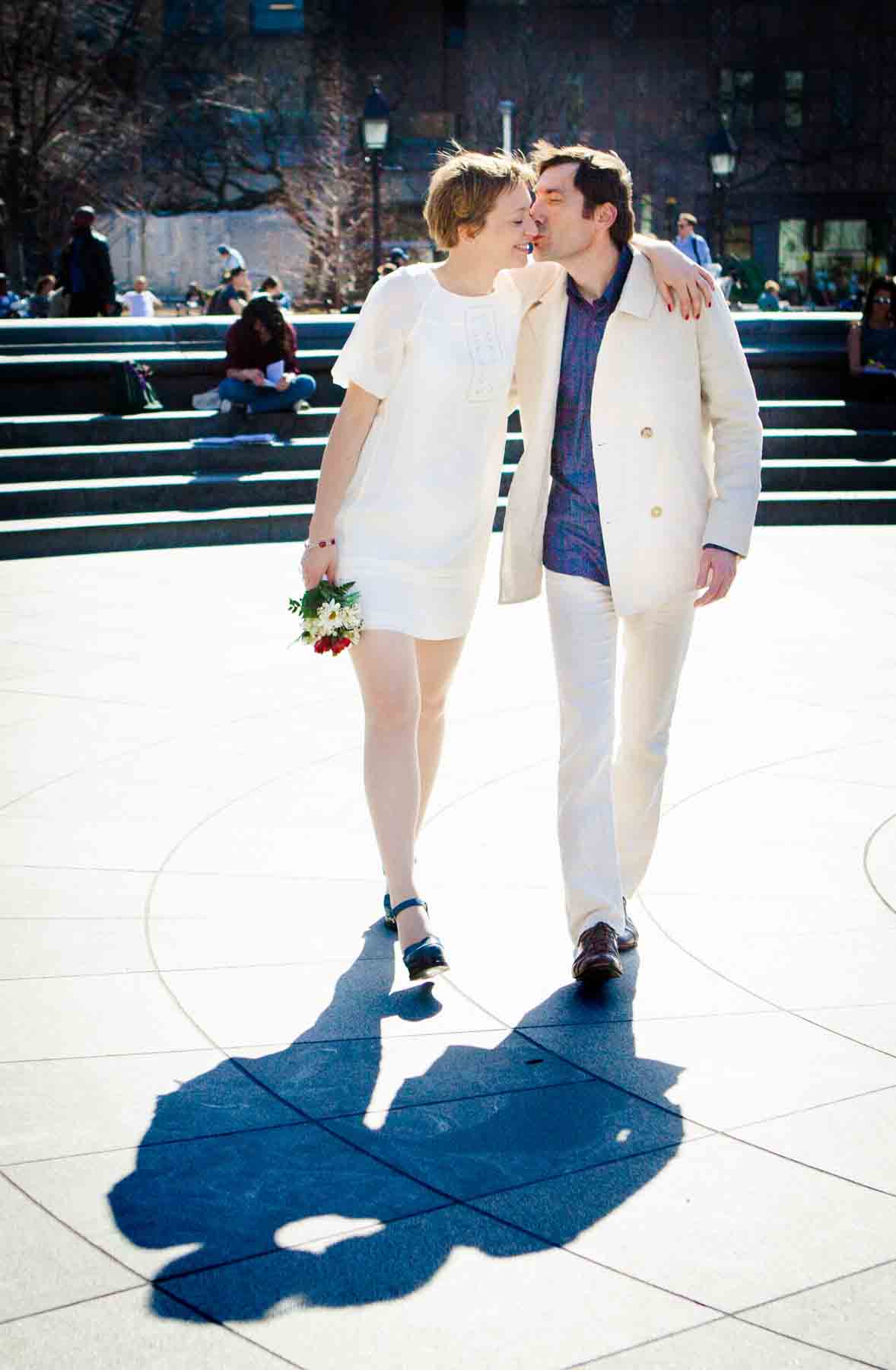 Couple walking close together with shadow on ground for an article entitled, ‘Are Couples Still Getting Married?’