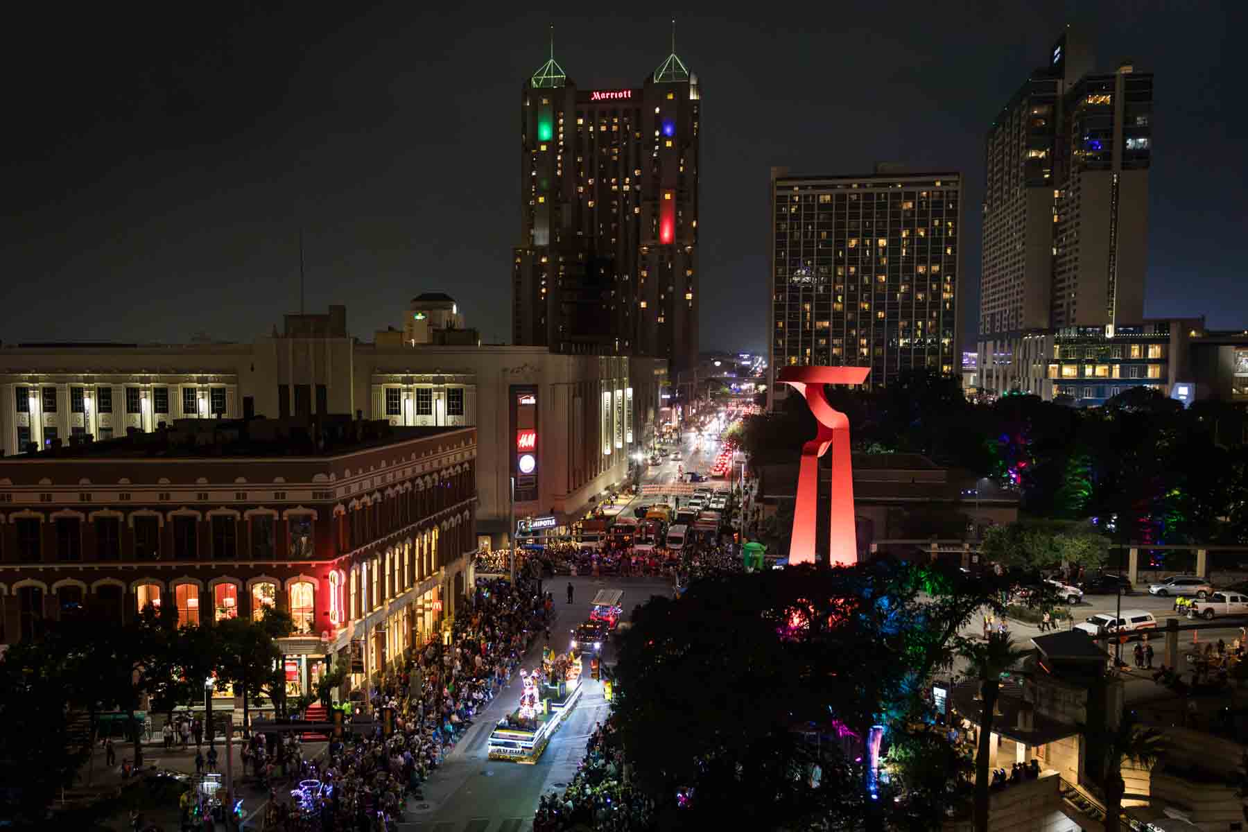 Up high view of downtown San Antonio during Fiesta Flambeau parade during Fiesta for an article on secret San Antonio photo shoot locations