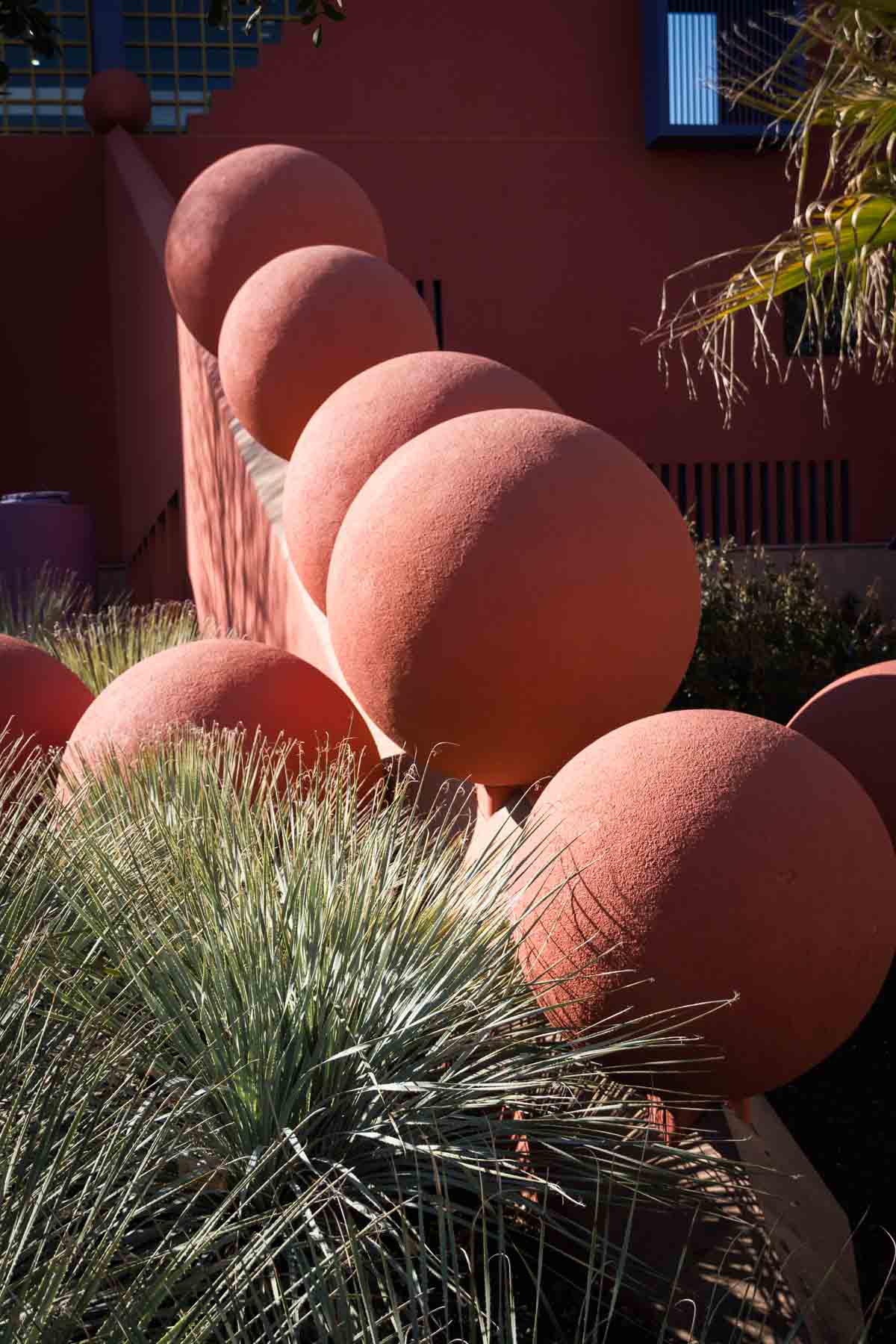 Round, orange sculptures at the entrance to the Central Library for an article on secret San Antonio photo shoot locations