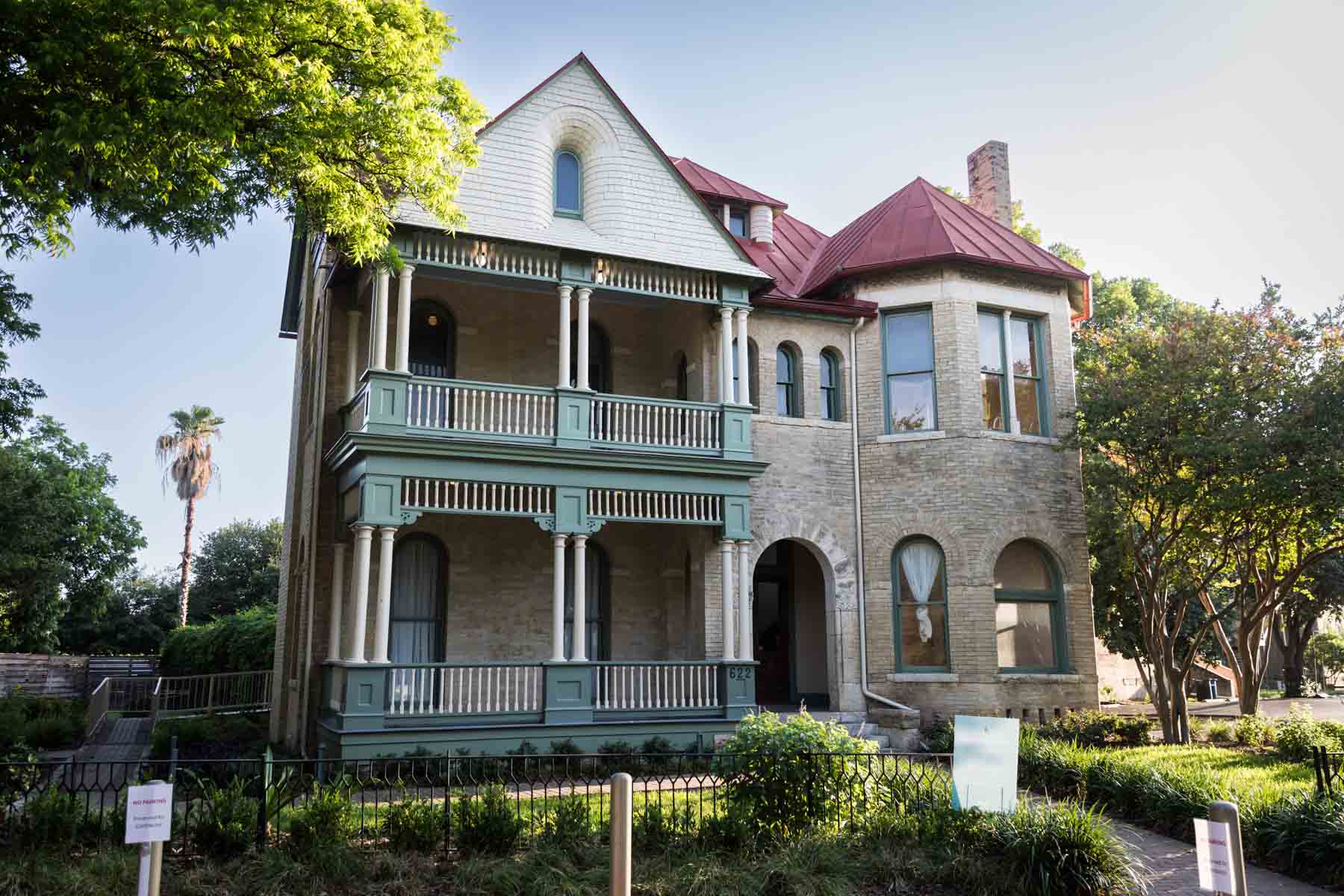 House with green front porch in Yanaguana Gardens for an article on secret San Antonio photo shoot locations